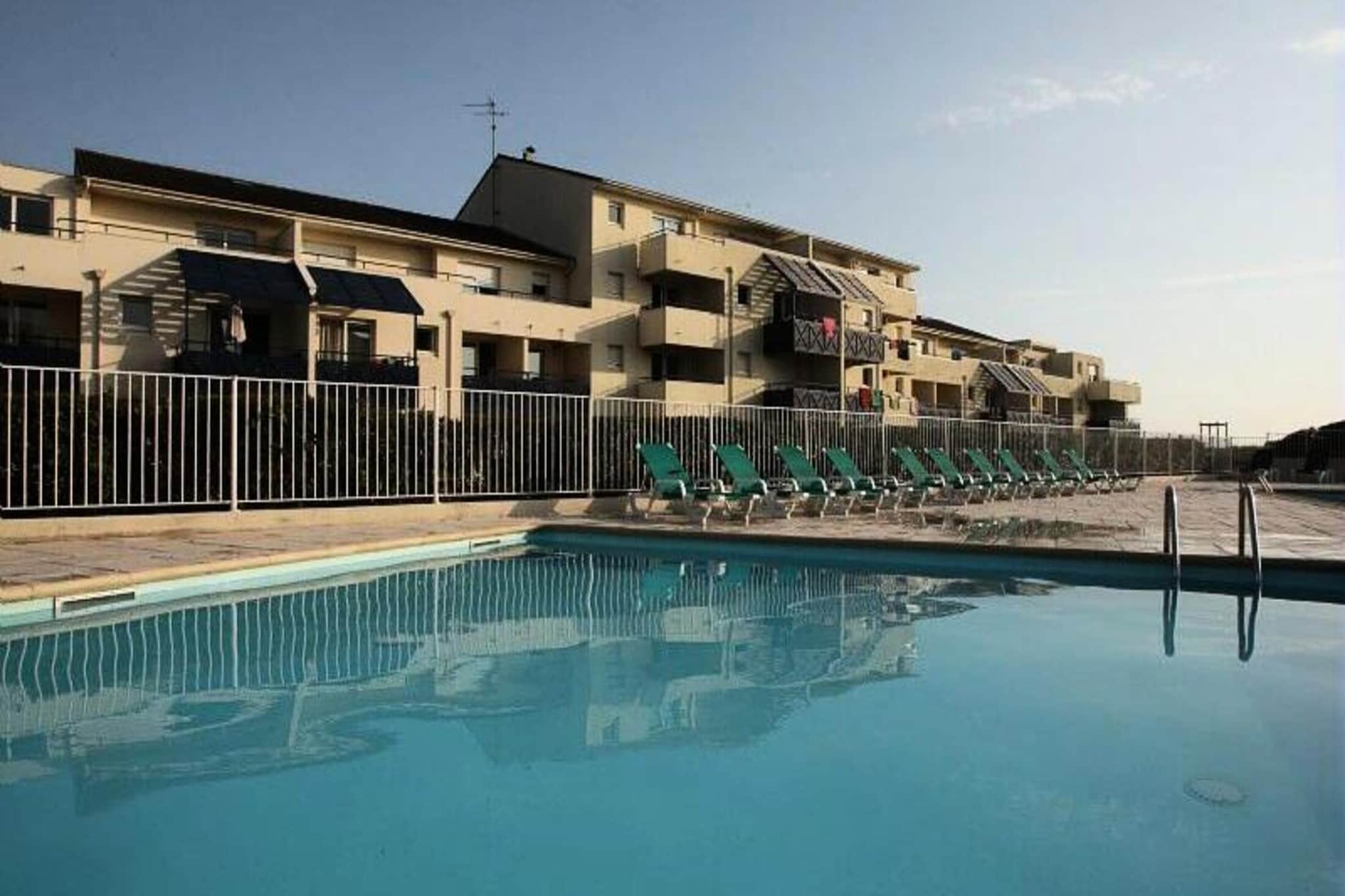 This residence offers private apartments with a living room, kitchen, and bathroom, perfect for up to 3 guests. Some accommodations are pet-friendly, but please confirm availability and pricing directly with the residence. The apartments are designed for comfort, and essential amenities are provided, including a maintenance kit. Free outdoor parking is available, with covered parking offered for a fee and subject to reservation. A deposit is required upon check-in, and additional services such as bed linen, towels, and end-of-stay cleaning are available for an extra charge.
Located just 300 meters from the beach and the vibrant center of Lacanau-Ocיan, the residence is in an ideal spot to explore the area. Guests can enjoy a variety of activities, including golf, horse riding, sailing, and kite surfing, ensuring a fun and active vacation for all. The lively center is home to shops, cafes, and restaurants, offering everything needed for a relaxing day out. The area also features a beautiful coastline, perfect for beachgoers.
The apartment includes a fully equipped kitchen with essential appliances, including a microwave, stovetop, and fridge. The bathroom features a shower, and the apartment is furnished for convenience. Guests can enjoy access to a shared swimming pool (open mid-June to mid-September) and a children's pool. For additional comfort, a baby kit is available for rent, and Wi-Fi access can be purchased for an extra fee.