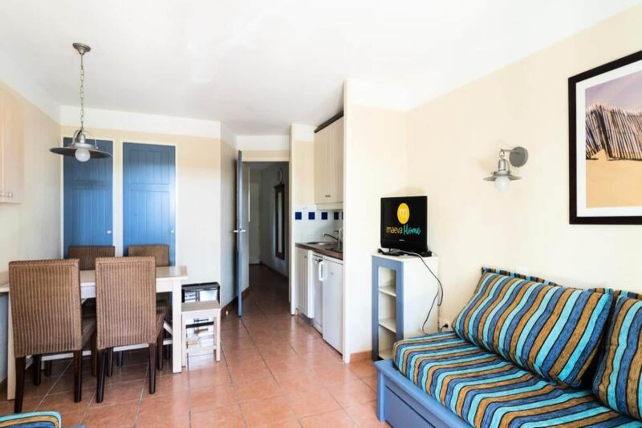 This spacious holiday home is set in a tranquil pine forest, providing a peaceful retreat just 3 km from the beaches and center of Lacanau Océan. With accommodations for up to 5 people, the apartment features a comfortable living room, a cabin area, and a well-equipped kitchen. It includes a bathroom with a WC, and guests can enjoy the calm of the green surroundings. The residence is not pet-friendly, ensuring a serene environment. The accommodation offers modern amenities like a TV, and guests can park their cars in the free parking area (subject to availability).

Ideally located near Lacanau beaches and a golf course, the property offers activities like cycling, surfing, yoga, and swimming lessons. Guests can enjoy a beach volleyball court, multi-sport court, and playground, while local cafes and markets are just a short distance away.

Inside, the apartment boasts a fully equipped kitchen with a stove, refrigerator, microwave, and dishwasher, allowing for convenient meal preparation. The accommodation is also fitted with a maintenance kit, and end-of-stay cleaning is included for higher-tier accommodations. A swimming pool and paddling pool are available during the warmer months, offering a great way to cool off. Additional services such as baby equipment and bed linens are available for an extra charge.