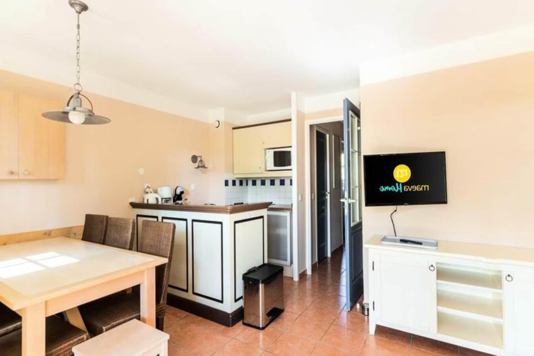 This spacious 2-room apartment accommodates up to 6 people, featuring one bedroom and a cabin area with a sofa bed. The apartment is designed with comfort in mind and offers pet-free, non-smoking living spaces. Enjoy amenities like a fully equipped kitchen, two bathrooms, and a living room with modern furnishings. The residence offers free parking (subject to availability) and a range of services, including additional cleaning and bed linen rental, which are available for an extra charge. 

The Lacanau les Pins residence is set in a magnificent 5-hectare pine forest, just 2-3 km from Lacanau Ocיan's beaches and town center. Guests can enjoy the nearby aquatic area with a swimming pool, paddling pool, and beach volleyball court. The area is perfect for outdoor activities like cycling, surfing, or visiting local cafes and markets. Bike rentals are available on-site, and guests can explore the nearby lakes and beaches. For a relaxing retreat, the calm of the pine forest offers a peaceful escape.

Inside the apartment, you'll find a well-equipped kitchen with a dishwasher, ideal for preparing meals during your stay. The spacious living area opens up to a comfortable dining space, perfect for family meals. The residence also provides a maintenance kit and end-of-stay cleaning (in select accommodation ranges), ensuring a hassle-free stay. Guests can relax at the pool or enjoy the nearby beaches and lake, offering plenty of opportunities for relaxation and adventure.