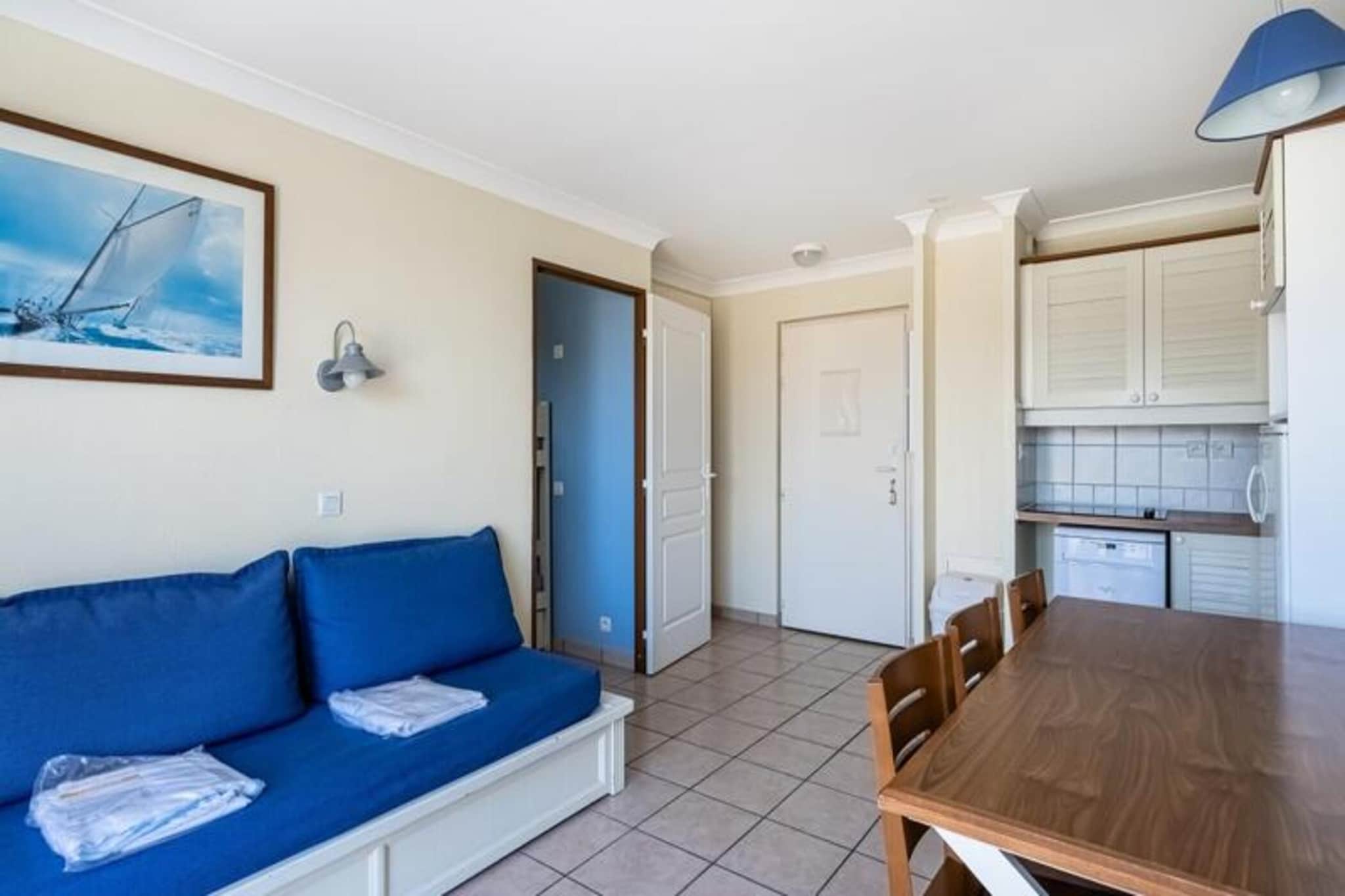 This charming apartment is ideally located just 300 meters from the Atlantic Ocean, offering easy access to the beach with the dune to cross. The property can accommodate up to 6 guests, featuring a living room with a sofa bed and trundle bed suitable for children, as well as two bedrooms—one with a double bed and the other with two single bunk beds. Pets are allowed in certain accommodations for an additional fee. A secure outdoor parking space is provided for your convenience, and the property also offers a television for entertainment.

The residence is in a prime location, with the town of Lacanau Océan within walking distance, and cycling is the best way to explore the surrounding area. Visitors can enjoy a range of activities nearby, including tennis, horse riding, sailing, and surfing, with the stunning Atlantic coast at your doorstep. There is also an unheated swimming pool with a children's pool, open from mid-June to mid-September, providing a perfect way to unwind after a day of outdoor adventures.

The apartment includes a fully equipped kitchen open to the living room, complete with a table and six chairs for dining. The bathroom has a bathtub-shower combination, and there is a separate toilet. Bed linen and towels are available for an additional charge, with the option for daily linen changes. The mandatory end-of-stay cleaning service can be arranged at check-in.