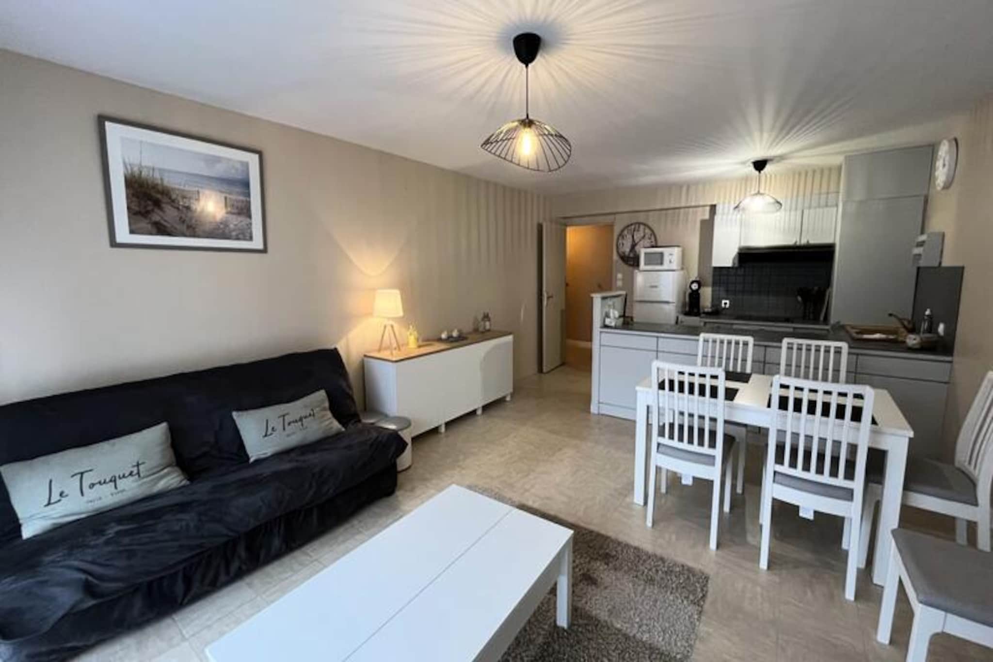 This bright and welcoming two-bedroom apartment accommodates up to six guests, offering a comfortable and convenient stay. The sleeping arrangements include two cozy bedrooms, each with a double bed, and one with an additional bunk bed. A spacious living room complements the open kitchen, creating a communal space to relax. The apartment includes a shower room equipped with a washing machine, dryer, and hair dryer, as well as a separate WC. Please note that bed linen and towels are not provided but can be arranged as an optional service.
Nestled in the heart of the city, this property is perfectly located for exploring nearby attractions. The bustling covered market, brimming with fresh produce and local delicacies, is just steps away. The sandy beach is a short walk from your doorstep, making it easy to enjoy sun-soaked days and seaside strolls. The central location also provides access to charming cafes, boutique shops, and vibrant nightlife, all within walking distance.
The fully equipped kitchen includes a dishwasher, toaster, and Senseo coffee maker, ensuring meals and snacks are a breeze to prepare. A free private parking space adds convenience for those arriving by car. With concierge service available to assist throughout your stay, this apartment combines comfort and practicality for a memorable getaway.