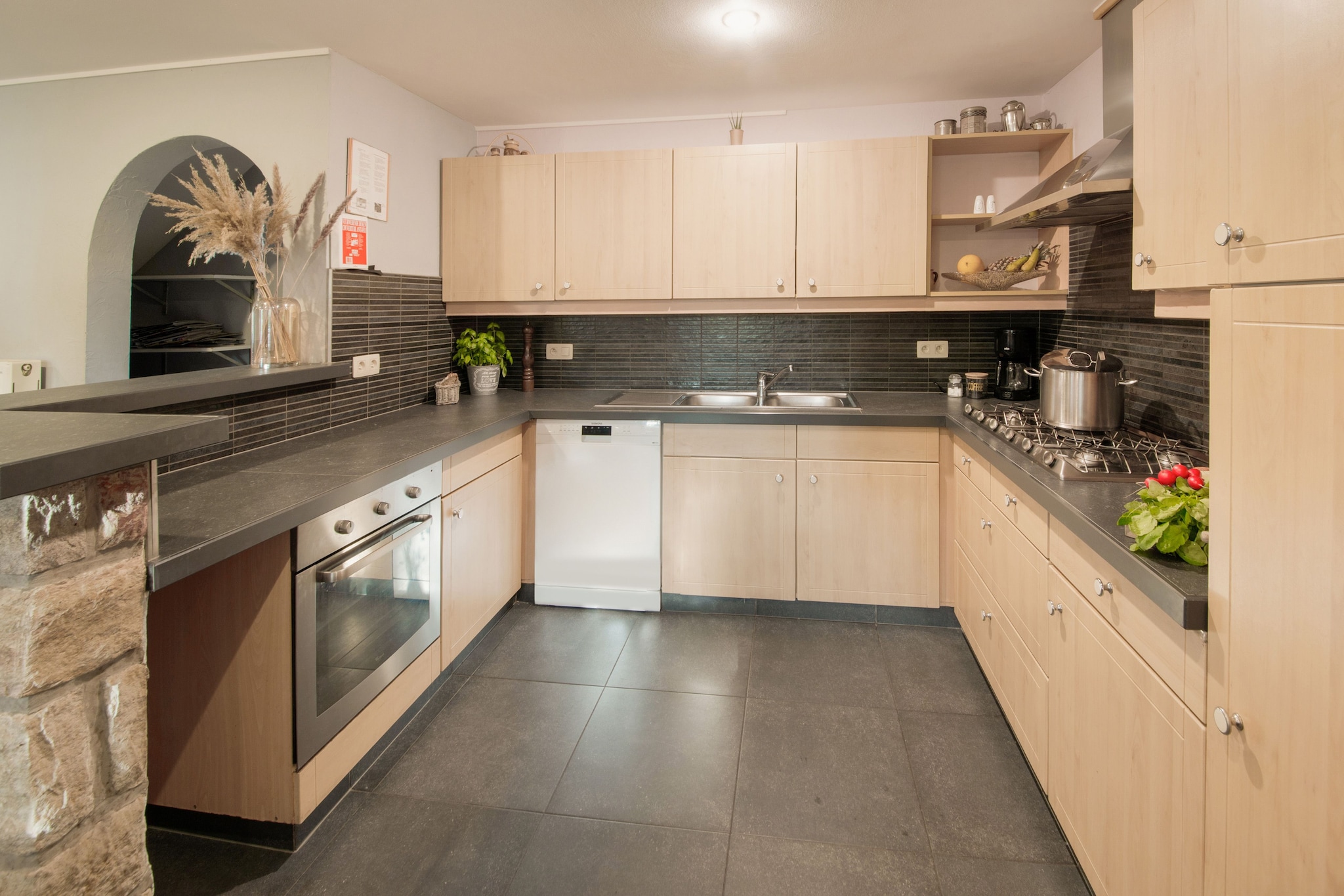 Ground floor: (bedroom(double bed(twin duvet, 140 x 200 cm)), bedroom(bunk bed(90 x 200 cm), bunk bed(90 x 200 cm), bunk bed(90 x 200 cm)), Bedroom with bathroom(double bed(twin duvet, 140 x 200 cm), shower, washbasin), Bedroom with bathroom(2x single bed(duvet, 90 x 200 cm), shower, washbasin), bathroom(shower, washbasin), bathroom(shower, washbasin), playroom(double sofa bed(twin duvet, 140 x 200 cm), TV, table football, billiards), relaxation area(Bubble bath, 2x shower, solarium, infrared sauna, sauna), pantry(tumble dryer, washing machine))\n\nOn the 1st floor: (Living room(TV(cable), dining table, dining table, stove(wood), seating area, bar, fridge), open kitchen(dining table, dining table, toaster, cooker(5 ring stoves, gas), coffee machine, coffee machine, oven, microwave, dishwasher, fridge, fridge-freezer), Bedroom with bathroom(double bed(140 x 200 cm), shower, washbasin), Bedroom with bathroom(double bed(140 x 200 cm), shower, washbasin))\n\nOn the 2nd floor: (bedroom(2x single bed(90 x 200 cm)), bedroom(single bed(90 x 200 cm), double bed(140 x 200 cm)), bathroom(bath tub, washbasin))\n\ntoilet, toilet, toilet, toilet, toilet, heating(central), terrace(roofed), garden(fenced), garden furniture, BBQ, parking, boules court, play equipment, football goal, Volleyball court