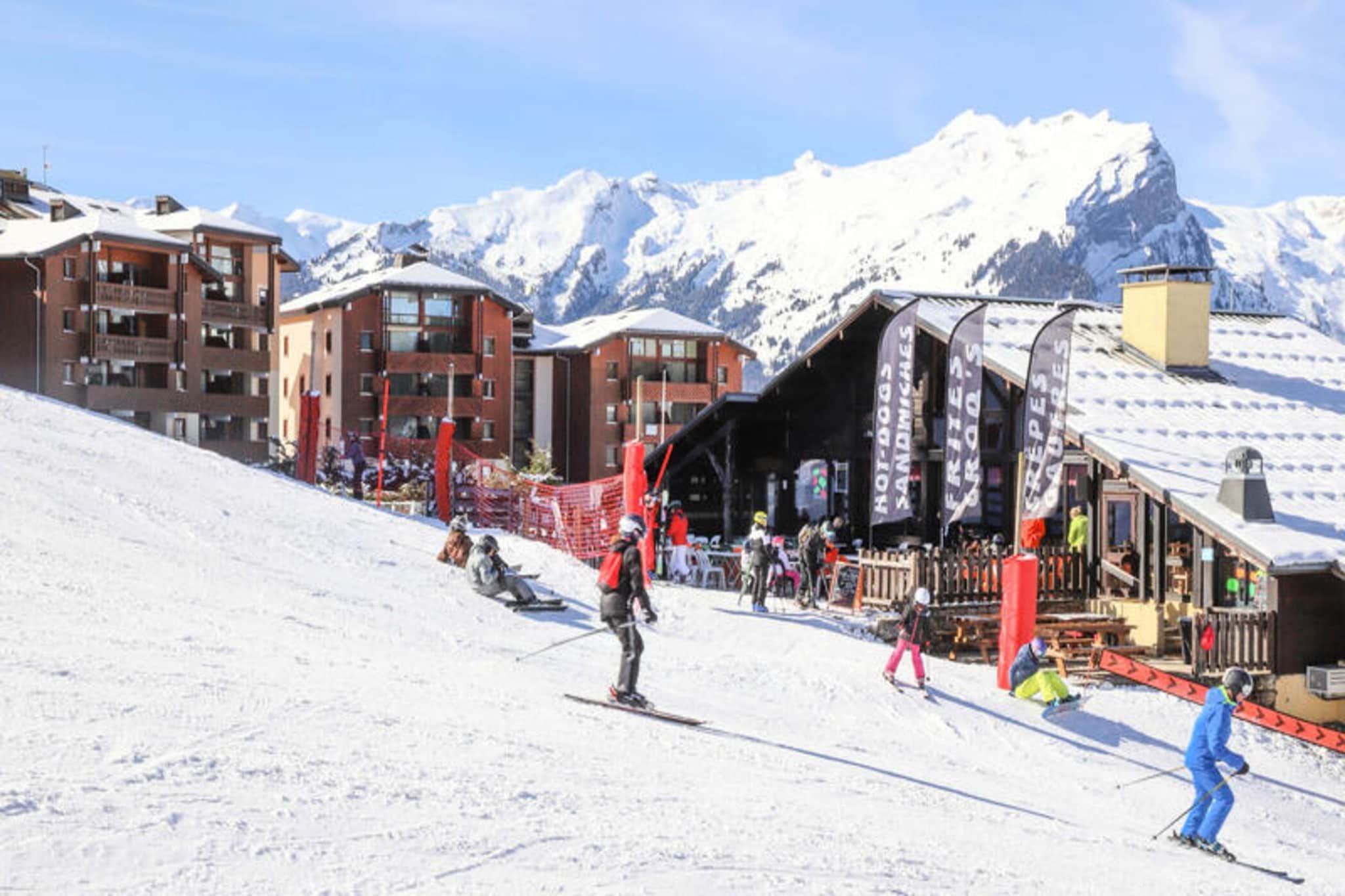 This cozy apartment is ideally located at the foot of the slopes, offering a comfortable stay for up to 4 guests. It includes a bedroom with a 140x190 cm bed, a sleeping area with a bunk bed (please note, the high bed is unsuitable for children under 6), and a pull-out sofa in the living room. The apartment is pet-free and non-smoking, providing a clean and quiet space for relaxation. Additional amenities include a vacuum cleaner, drying rack, and a ski locker for your convenience. Please note that internet access is not available in the apartment.
Situated in Morillon 1100, this apartment offers a prime location with easy access to the ski slopes, making it perfect for ski enthusiasts. Enjoy breathtaking views of the slopes from the south-facing balcony, equipped with garden furniture, including a table, 3 chairs, and a parasol. The vibrant resort also features local cafes and shops, allowing guests to explore the area and enjoy the surrounding alpine atmosphere.
The apartment comes with a fully equipped kitchen, complete with a top refrigerator, electric hobs, a mini oven, microwave, toaster, pressure cooker, washing machine, and kitchen utensils. The bathroom includes a bathtub and a toilet. After a day on the slopes, guests can relax in the warm and inviting living room, or unwind on the balcony while enjoying the beautiful view.