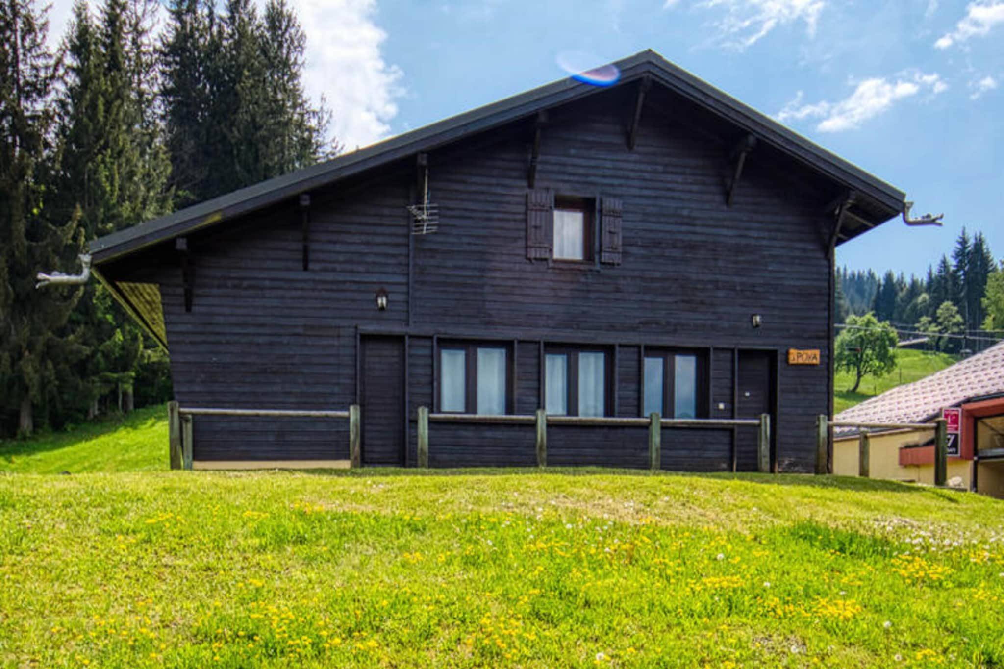 This charming wooden chalet, located directly on the snow front, offers a traditional alpine experience with modern comforts. Accommodating 10-12 guests, it features five bedrooms: one with a 140x190cm bed, two with three 80x190cm single beds each, and two with two 80x190cm single beds each. Bedding is provided. The chalet is non-smoking and does not allow pets. Two parking spaces are available approximately 50m away. A sauna is available for relaxation.
Situated at the foot of the Morillon 1100 slopes, this chalet provides direct ski-in/ski-out access. In summer, enjoy the terrace with garden furniture and mountain views. The location offers opportunities for skiing, hiking, and other mountain activities. While specific details about nearby cafes and markets aren't provided, its location within a resort suggests access to local amenities.
The chalet's ground floor features an entrance with a ski locker, a spacious living room with a TV, a fully equipped kitchen, a shower room with a WC, and a separate toilet. Upstairs, there are two additional shower rooms and a separate toilet. The kitchen includes a fridge/freezer, hotplates, oven, washing machine, dishwasher, microwave, two coffee makers, toaster, kettle, raclette machine, and fondue machine. Wi-Fi is provided, though connectivity issues are disclaimed. A vacuum cleaner and drying rack are also available.