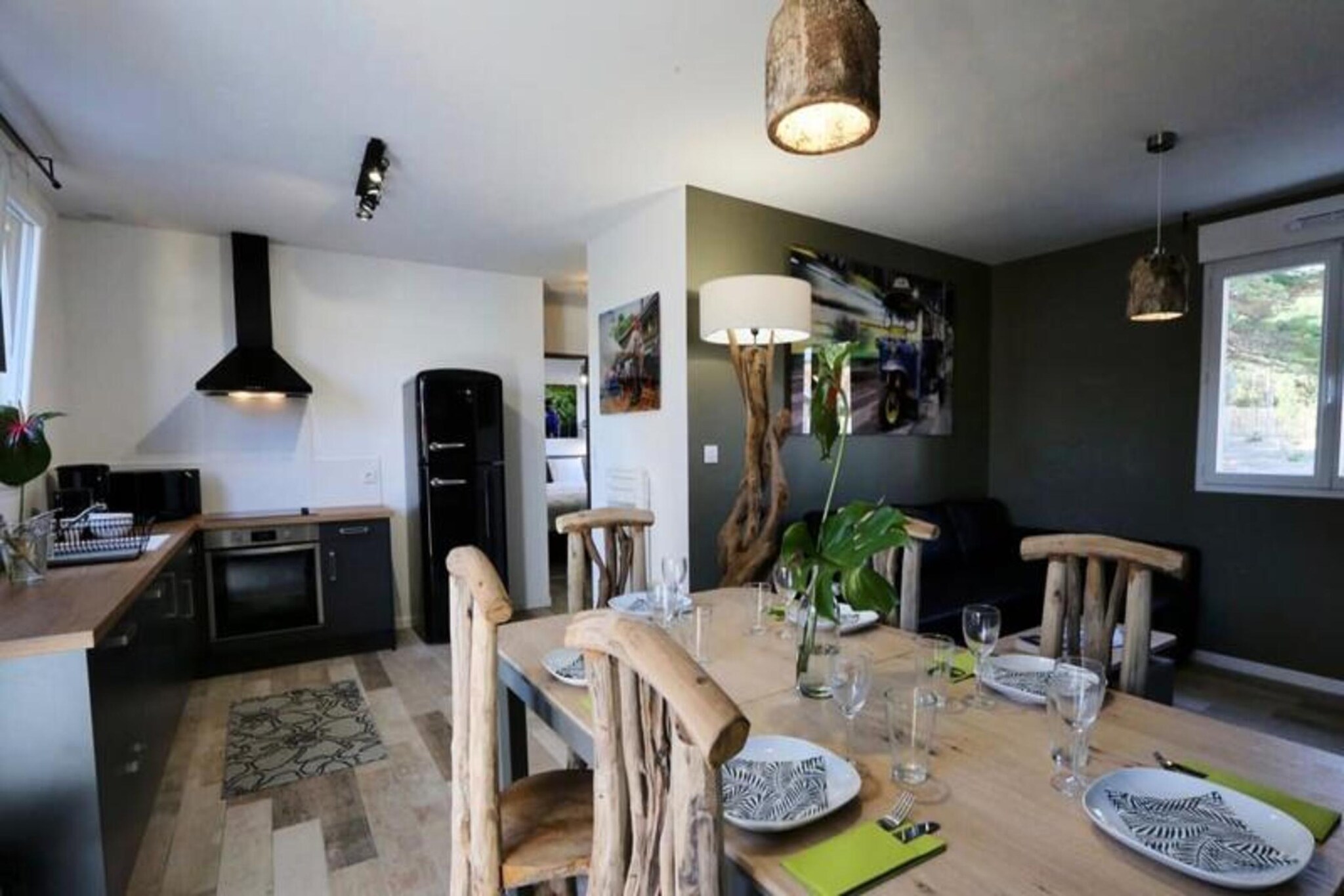 This charming 50m² apartment, designed with a Thai-inspired theme, offers a relaxing stay for up to 6 guests. The living room features a convertible double sofa bed, while the two bedrooms each have double beds. The property is non-smoking, and pets under 25kg and not noisy are welcome for a fee. A €750 deposit is required, and towels are not provided, though rental is available. A private 6-seater spa is available for an additional charge, perfect for unwinding. Guests are expected to clean before departure or can opt for an end-of-stay cleaning service for €85.
Nestled in the heart of the Pays-de-Monts National Forest, this retreat offers easy access to nature. The beach is just a few minutes away, and there are numerous cycling paths surrounding the area, ideal for outdoor enthusiasts. The peaceful forest setting provides a serene backdrop for a rejuvenating getaway. Nearby, you'll find local shops, cafes, and restaurants to explore during your stay.
The apartment includes a fully equipped kitchen with an oven, fridge-freezer, dishwasher, microwave, ceramic hob, coffee maker, toaster, Nespresso machine, and kettle. Additional amenities include a washing machine, ironing board, TV with TNT channels, and a hairdryer. Outside, a spacious wooden terrace with garden furniture, a parasol, and a barbecue or electric plancha enhances the vacation experience.