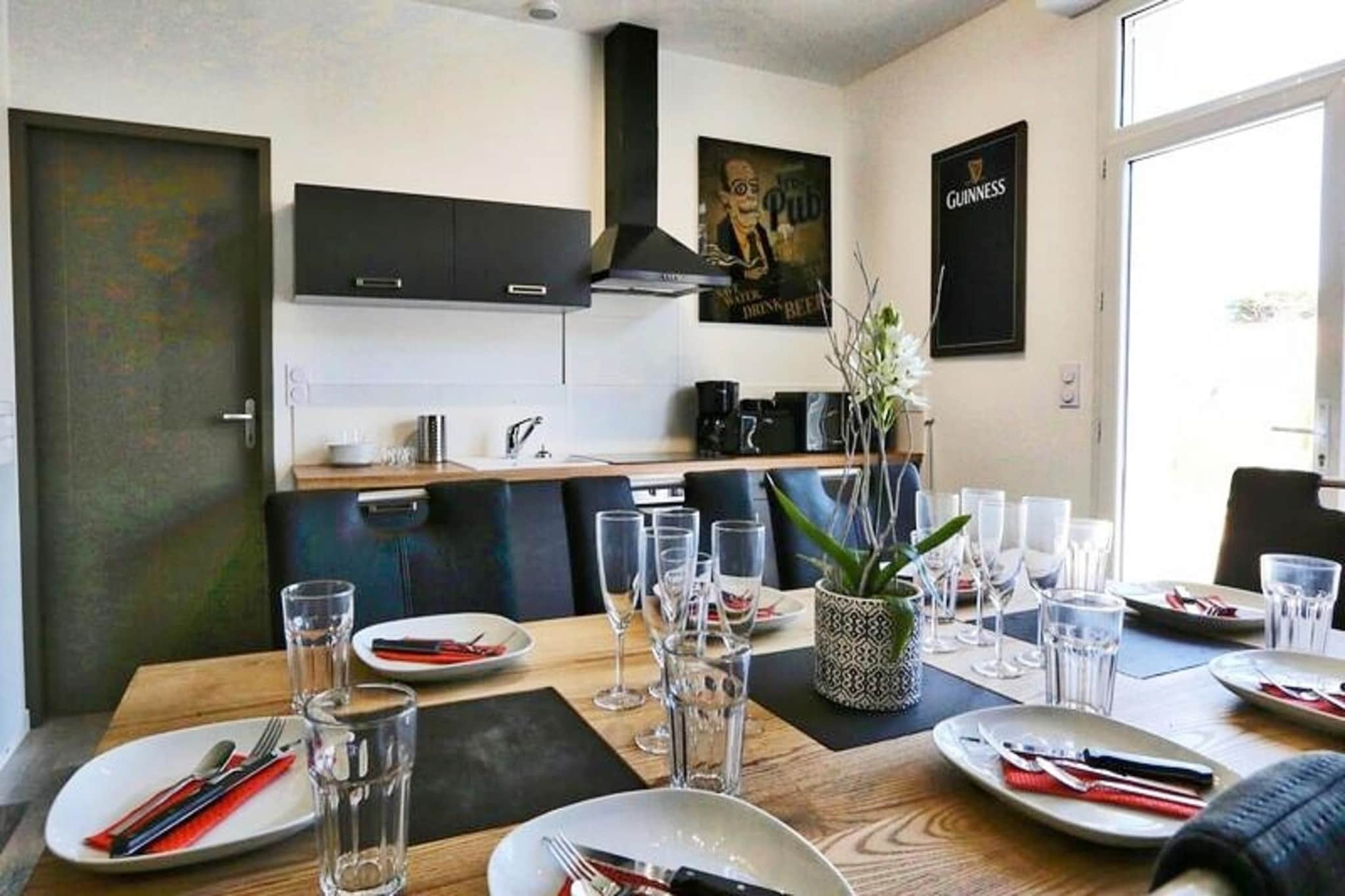 This charming 70m² holiday home, decorated in a cozy Irish theme, can accommodate up to 8 people. It features three bedrooms with double beds and a convertible double sofa bed in the living room for additional sleeping space. The property is pet-friendly, welcoming pets under 25 kg for a small fee. Bed linens are provided, while towels are available for rent. The home is perfect for families or groups, offering a private retreat with a tranquil atmosphere.
The holiday home is situated in the heart of the Pays-de-Monts national forest, just a few minutes from the beach. Guests can explore the area’s beautiful cycle paths and enjoy the surrounding nature. The location is ideal for outdoor enthusiasts looking to unwind and explore the picturesque landscape of the region. Additionally, the Domaine offers easy access to nearby cafes and shops for your convenience.
Inside, the fully equipped kitchen includes an oven, fridge-freezer, dishwasher, microwave, and all necessary utensils for preparing meals. The living room is equipped with a television and the property also offers a private 6-seater spa (optional) for ultimate relaxation. Other amenities include a washing machine, ironing board, and hairdryer, making this a perfect home for a comfortable stay.