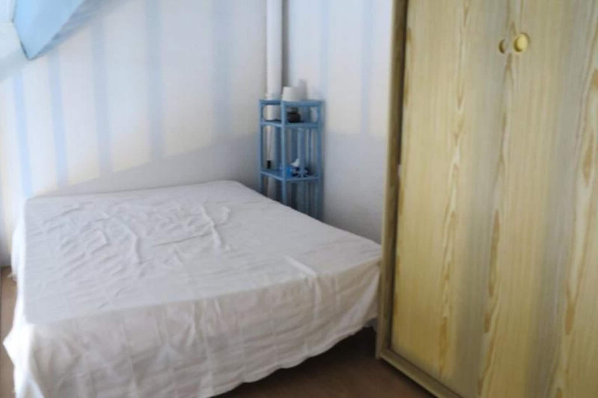 This pretty house, located in the charming Hameau de l'Amיlie, offers a cozy retreat just a short walk from the beach. The living space features a comfortable sofa bed and a television for relaxing after a day of exploration. The house includes a bedroom with two single bunk beds, along with a mezzanine area that has a double bed, offering ample sleeping space for families or small groups. The bathroom comes with a WC for added convenience. Pets are not allowed, and a deposit is required on-site. Holiday vouchers are accepted for booking.

The property is ideally located with shops, cafes, and restaurants just a short distance away, allowing you to easily enjoy the local area. The beach is only a stone's throw away, perfect for those looking to relax by the sea or enjoy water activities. Whether you prefer to dine out or explore the local market, the vibrant surroundings offer plenty of options for a memorable stay.

Additional amenities include a well-equipped kitchen area, ideal for preparing meals during your stay. The bathroom includes all the necessary facilities, and the house is also equipped with heating to ensure comfort throughout the year. Guests can enjoy the small fenced garden with garden furniture, perfect for outdoor relaxation. A parking space is also provided for your convenience.