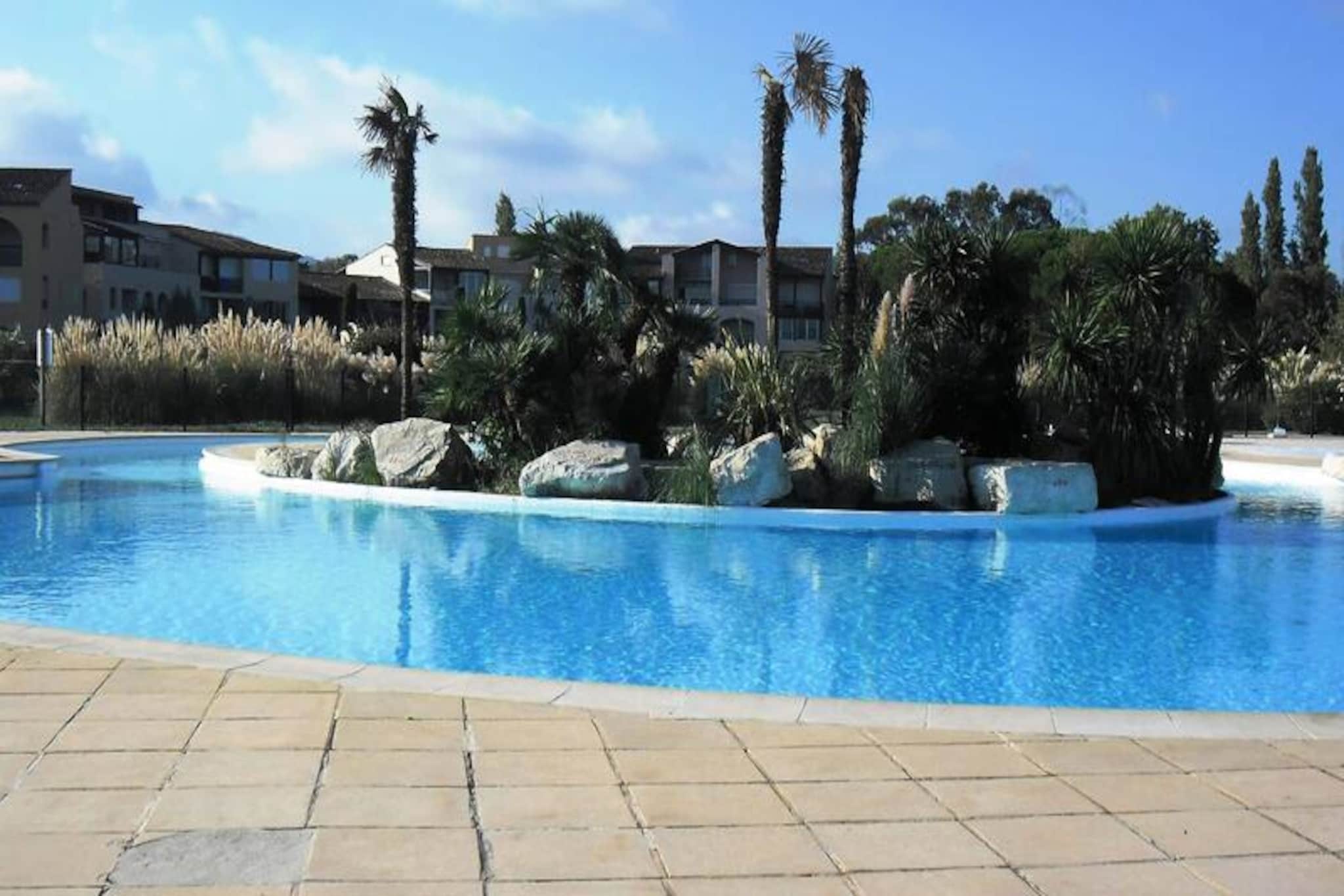 This charming ground-floor apartment is ideal for up to 4 guests, offering a cozy bedroom with a ceiling fan and mosquito net, a cabin with a double convertible sofa, and a separate bathroom and toilet. The apartment features a large terrace, perfect for dining al fresco, and is located in a residence with direct access to the beach. It’s a great option for families or friends looking for a relaxing getaway by the sea. The property also includes a security deposit, tourist tax, and optional linen rental for added comfort.
The location of this apartment offers easy access to a variety of nearby attractions. Just 150 meters from the beach, guests can enjoy the sand and sea, while restaurants are only 200 meters away. For those wishing to explore further, the vibrant town of St-Tropez is just 6 kilometers away, offering plenty of shops, cafes, and entertainment options. The residence itself features a stunning 650 m² lagoon swimming pool, open from May to October, as well as two tennis courts for guests’ enjoyment.
Inside the apartment, you’ll find a fully equipped kitchen with a dishwasher, microwave, and induction hob, allowing you to prepare your own meals. Other amenities include a flat-screen TV, washing machine, iron and ironing board, hairdryer, and a Nespresso coffee maker for added convenience. The apartment also features ceiling fans in the living room and bedroom for optimal comfort. A square-assigned parking spot is included.