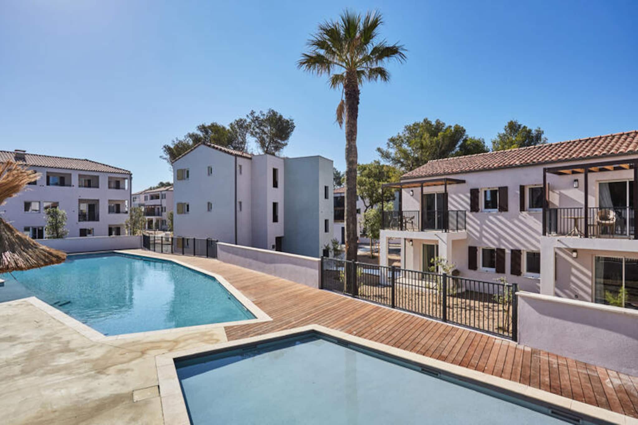 This brand new residence offers comfortable accommodations for families or groups, with a living room featuring a pull-out or convertible sofa, and three bedrooms with either double beds or two single beds. The apartment includes a shower room, separate WC, and modern amenities like WiFi access. Pets are welcome for an additional fee, with certain conditions regarding vaccinations and leashing within the property. Bed and bathroom linen are provided, and parking is available with one outdoor space per accommodation.

Located near the stunning beaches and attractions of the Côte d’Azur, this property allows easy access to various cultural and outdoor activities. Visitors can enjoy kite surfing, windsurfing, sailing, horseback riding, hiking, and cycling in the surrounding area. The vibrant local cafes, shops, and markets offer the perfect opportunities for exploring the charm of the region.

The apartment features a fully equipped kitchenette, ideal for preparing meals during your stay. Enjoy your mornings with the option of breakfast service (additional charge). For families, a Baby Kit (bed, high chair, and bath) is available upon request. The residence also boasts an outdoor swimming pool, including a secure paddling pool for children, offering hours of relaxation and fun.