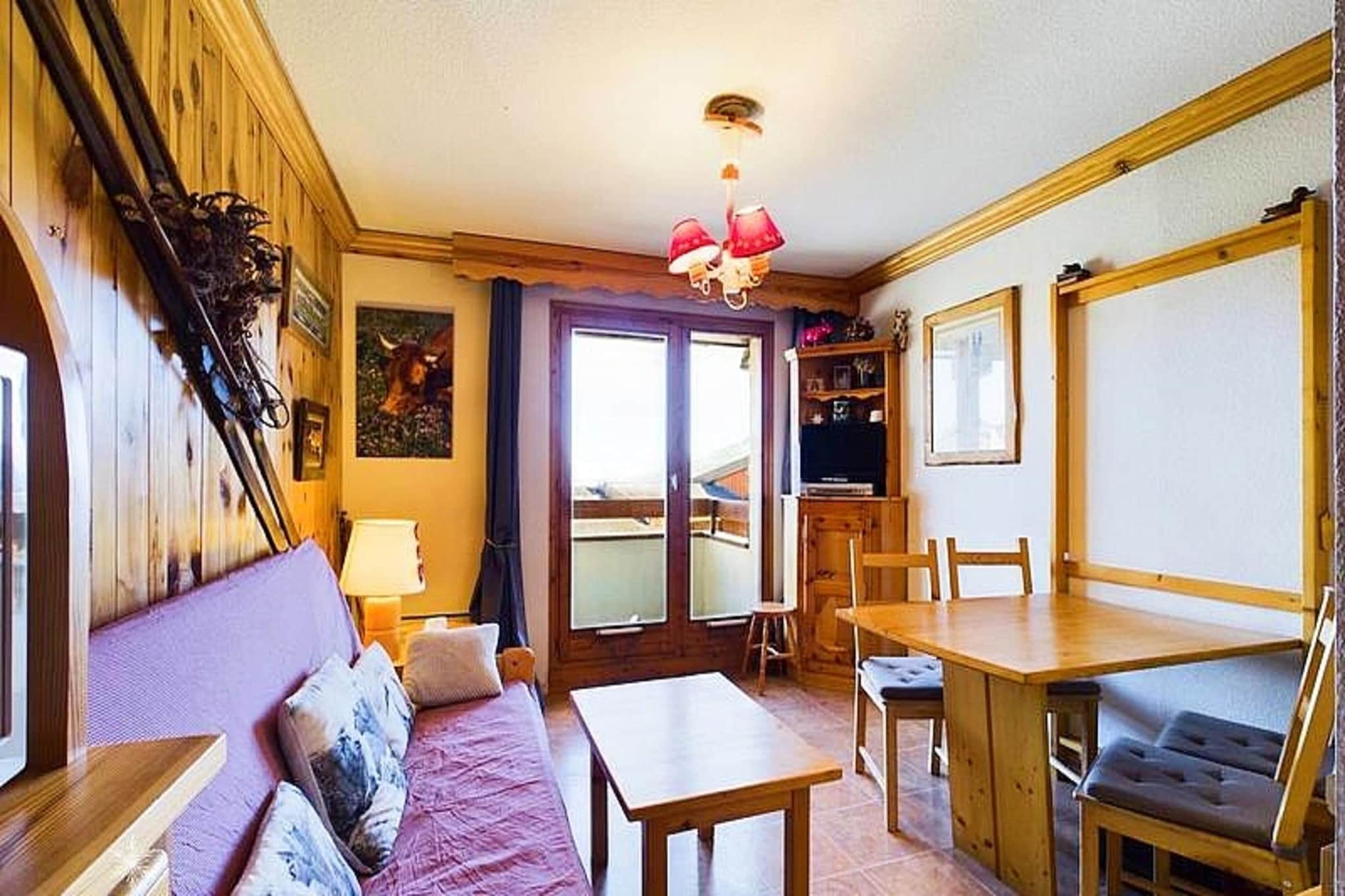 The **Les Hauts de la Rosière residence** is ideally located at the foot of the slopes and just 50 meters from local shops, offering easy access to both the slopes and amenities. The residence is equipped with an elevator that provides direct access to the slopes from level 6, making it perfect for a skiing getaway. The HTR208 studio cabin accommodates 4 to 5 people and features a south-west facing balcony with stunning views over the valley.

This 27m² studio cabin includes a mountain corner with a single folding bed, a shower room, and a separate toilet. The living room offers a convertible sofa for two people, while the kitchenette is equipped with 2 electric hotplates, a grill, and a refrigerator. The cabin also has a double bed in a separate sleeping area, providing ample space for guests. A flat-screen TV is provided for your entertainment, and the apartment includes a ski locker for storing equipment.

In addition to these features, the residence offers a basement parking space, making it convenient for those traveling by car. Please note that end-of-stay cleaning, sheets, and towels are not included in the rental price and are available for an additional fee.