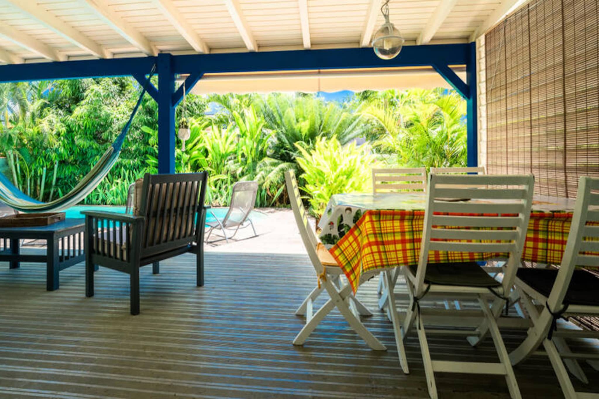 This quiet villa (lower part of a larger house) offers private access, a pool, and a wooded garden. It sleeps four in two air-conditioned bedrooms (one with two 90cm beds, one with a 160cm bed). Linens/towels are included, and housekeeping is provided. Parties are not allowed. A deposit is required. It can be rented with the upper part (separate entrance/pool) for eight guests total.

Located in Saint-François, Guadeloupe, it’s near beaches, restaurants, and the town center (5 minutes). The marina, golf course, casino, and aerodrome are nearby. Beautiful beaches (Raisins Clairs, etc.) are a short drive away, as is Pointe-des-Châteaux. A local market offers fish and spices.

The holiday home features a covered terrace, an equipped kitchen open to the living room, a shared bathroom, and a toilet. Amenities include internet and a water reserve system. A welcome cocktail and dedicated concierge service are provided, along with access to partner services (excursions, rentals, etc.). This villa offers a relaxing base for exploring Guadeloupe.