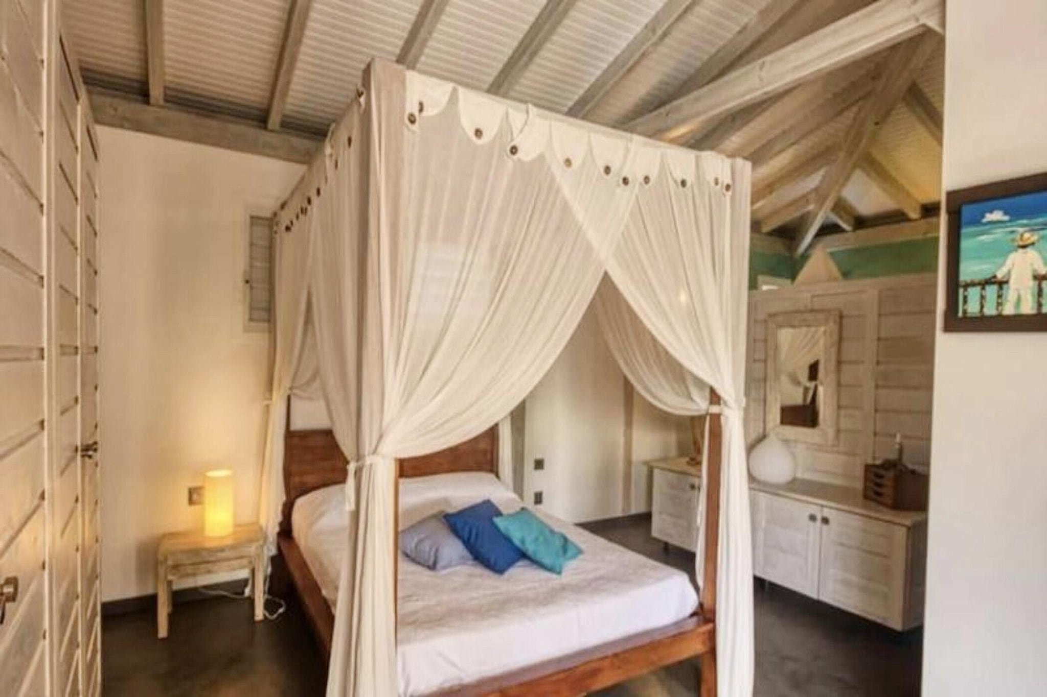 This charming Creole-style villa offers a tranquil escape. Two air-conditioned bedrooms (one 160cm bed, one queen) each have private bathrooms. Inquire about pets. A second villa may be available for larger groups.

Located in Saint-François, this holiday home is near beaches, golf, the marina, and shops. It's close to the town center and a short drive from the airport. Nearby are restaurants, markets, and water sports opportunities. Pointe-des-Châteaux is a short drive away.

The villa features a well-equipped kitchen opening onto a terrace and pool. Amenities include modern appliances, linens, and Wi-Fi. A childminder is available nearby. The property has water reserves and mosquito nets. Welcome drinks and a concierge service are provided.