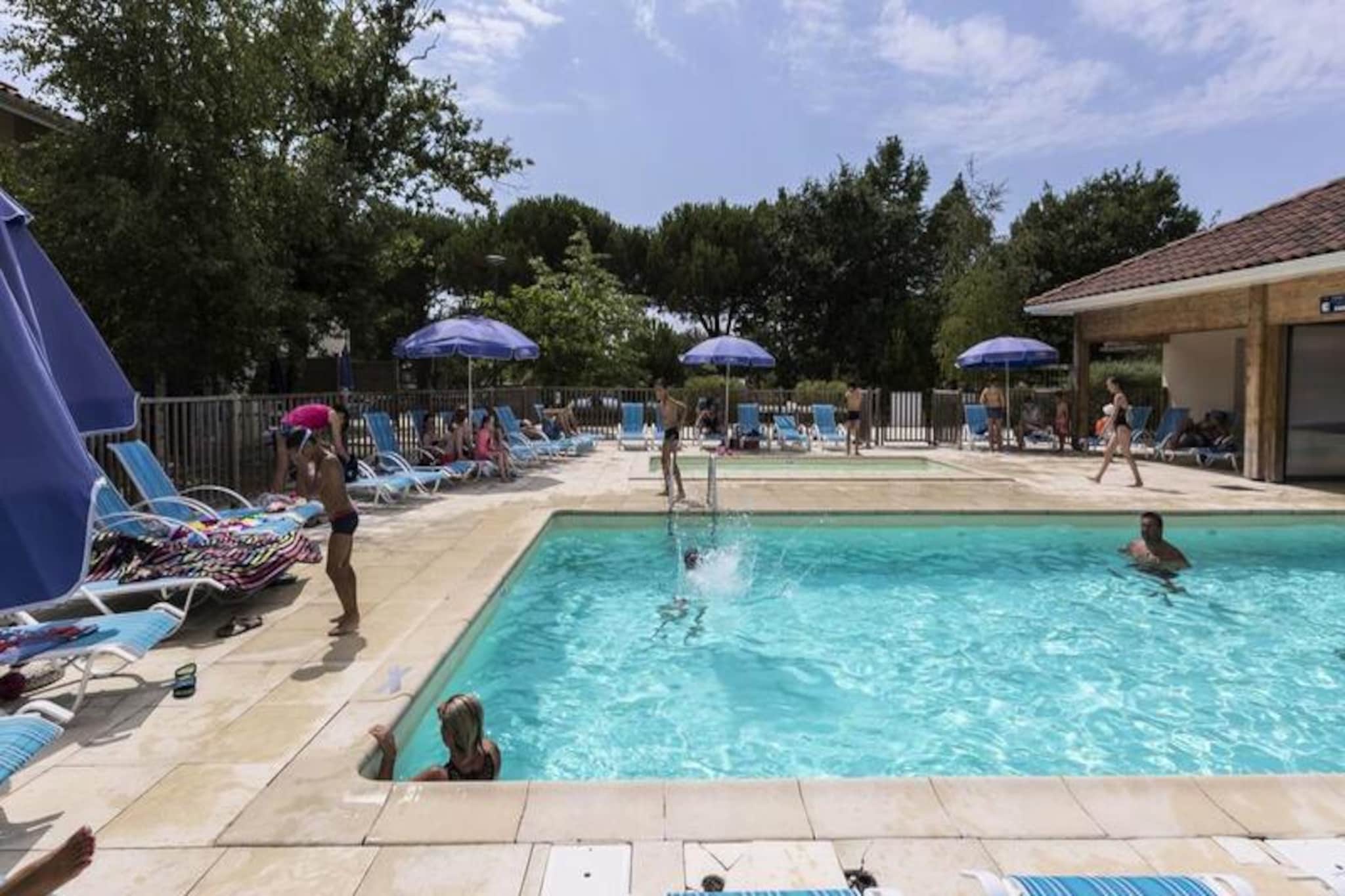 This charming apartment in Hourtin accommodates up to 4 people with a living room featuring a trundle bed for 2 and a separate bedroom with 2 single beds. It includes a shower room, WC, free Wi-Fi, and a TV. A terrace or balcony offers scenic views, and pets are welcome for an additional fee. The property is equipped with all you need for a relaxing stay, and a parking space is available.

Just 400 meters from the city’s port and shops, the apartment is in a vibrant area with plenty of dining and shopping options. Hourtin offers a mix of water sports and outdoor activities, with the Hourtin Carcans lake just steps away. The area is perfect for exploring on foot, by bike, or horseback, surrounded by forests, dunes, and beaches.

The apartment has a fully equipped kitchen to prepare meals, and you can enjoy a heated swimming pool and paddling pool from mid-April to September. The residence also offers a fitness room, children’s play area, table tennis, and bowling alley. A baby kit is available for rent, and end-of-stay cleaning is included for your convenience.