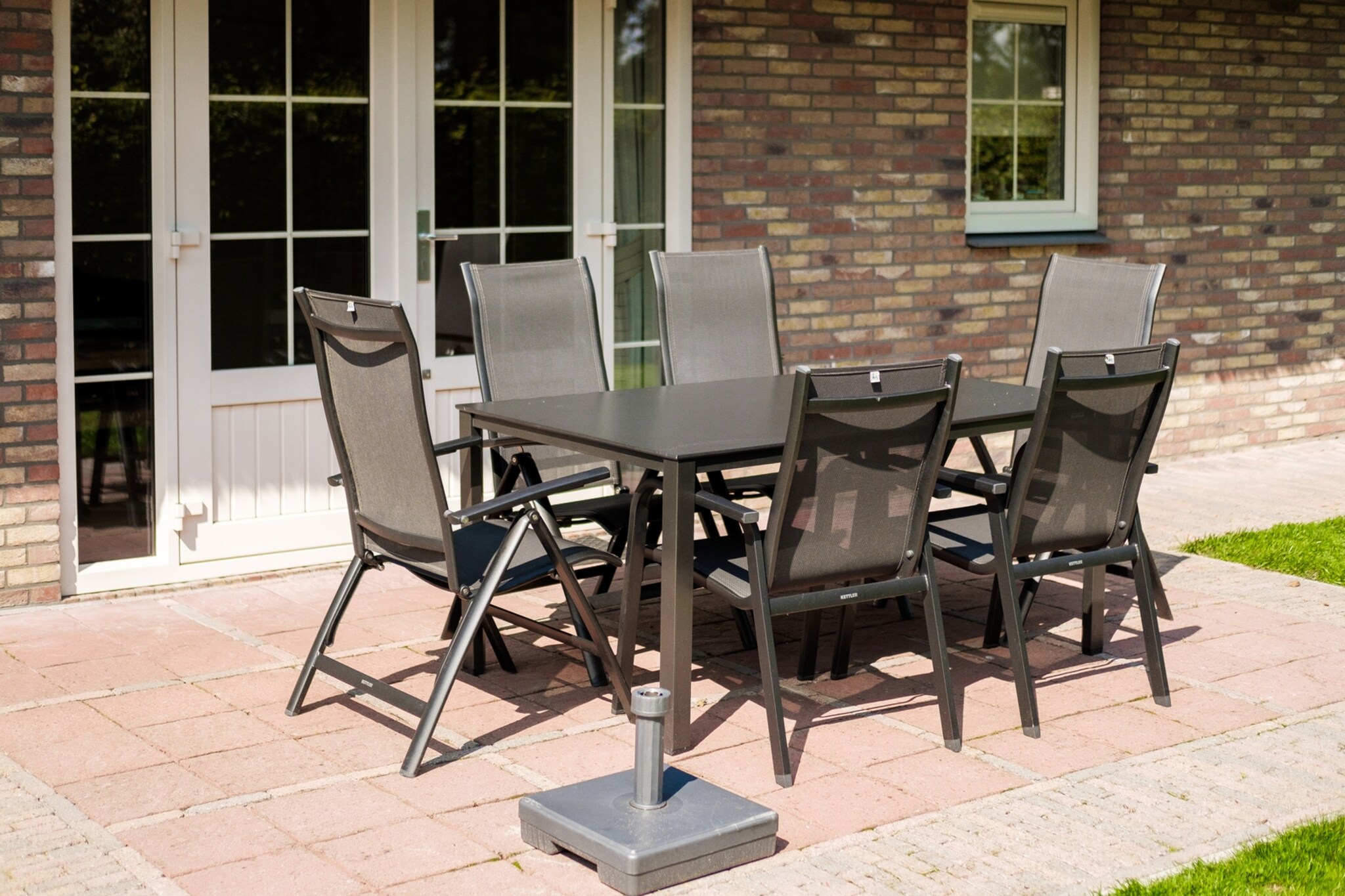 Ground floor: (open kitchen(hob(4 ring stoves, gas), electric kettle, toaster, coffee machine(filter), oven, combination microwave, dishwasher, fridge-freezer, dishes and cutlery, Cooking basics), Living/diningroom(TV(cable, dutch television channels, german television channels), dining table, seating area), Bedroom with bathroom(double bed(180 x 200 cm), bath tub, washbasin, toilet))\n\nOn the 1st floor: (bedroom(double bed(180 x 200 cm)), bedroom(single bed(90 x 200 cm)), bedroom(single bed(90 x 200 cm)), bathroom(shower, washbasin), toilet(washbasin, toilet))\n\nGarden Furniture , Bubble bath, sauna, washing machine, patio, garden, BBQ, parking, ironing board, iron, Charging post for electric cars