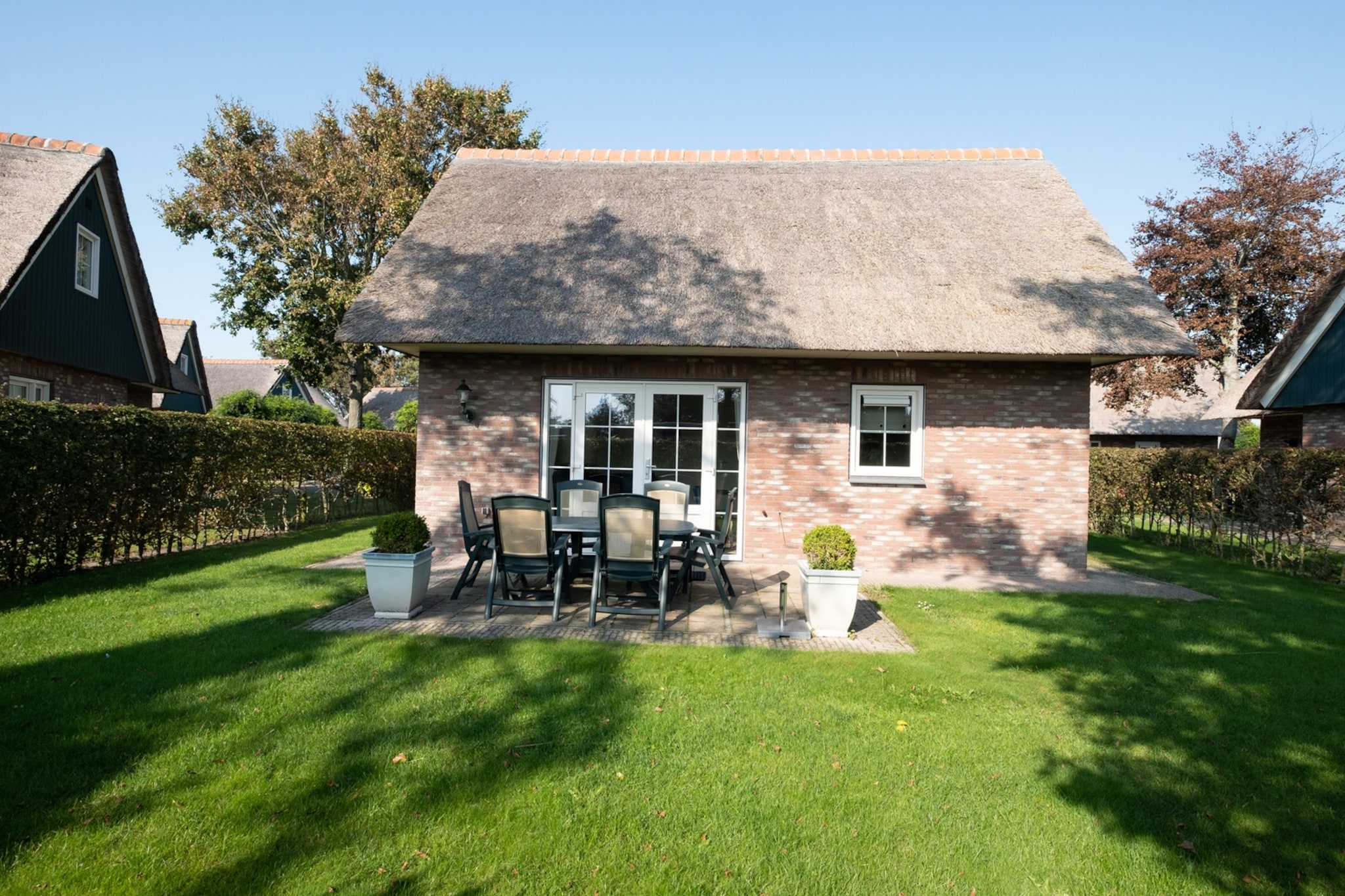 Escape to a relaxing retreat at Villapark Anzelhoef in Sint Maartenszee, a small-scale park just 10 minutes by bike from the beach and a short walk to the forest. This property is ideal for those seeking a cycling or walking holiday near the sea, or for a peaceful weekend getaway. The living room is tastefully furnished with two sofas, two armchairs, and a spacious coffee table. Enjoy cable TV with Dutch and German channels. The dining area features a large table with six chairs, and a high chair is available for little ones. The fully equipped open kitchen includes a dishwasher, filter coffee maker, kettle, toaster, 4-burner gas cooker, and combination microwave.

The home has three comfortable bedrooms. On the ground floor, there is a bedroom with two single beds (80x200 cm). Upstairs, you'll find a double bedroom (160x200 cm) and a bedroom with two single beds (90x200 cm). Ample wardrobe space is available in all bedrooms, which are all equipped with single mattresses and duvets. There is also a cot in the house, though you'll need to bring your own bed linens for the children's bed. 

Enjoy the sunny garden, accessed via the living room's garden door, with a beautifully landscaped terrace and garden furniture. Barbecuing is permitted with an electric or gas grill. Parking is available for one car at the accommodation, with additional spaces in the general car park. Please note that electric cars cannot be charged at the bungalow. The property offers free WiFi and does not allow pets. Linen is not included in the booking, so please bring your own or rent it during booking.

Note: The bed linen is optional and available for â‚¬ 13 p.p./Stay.