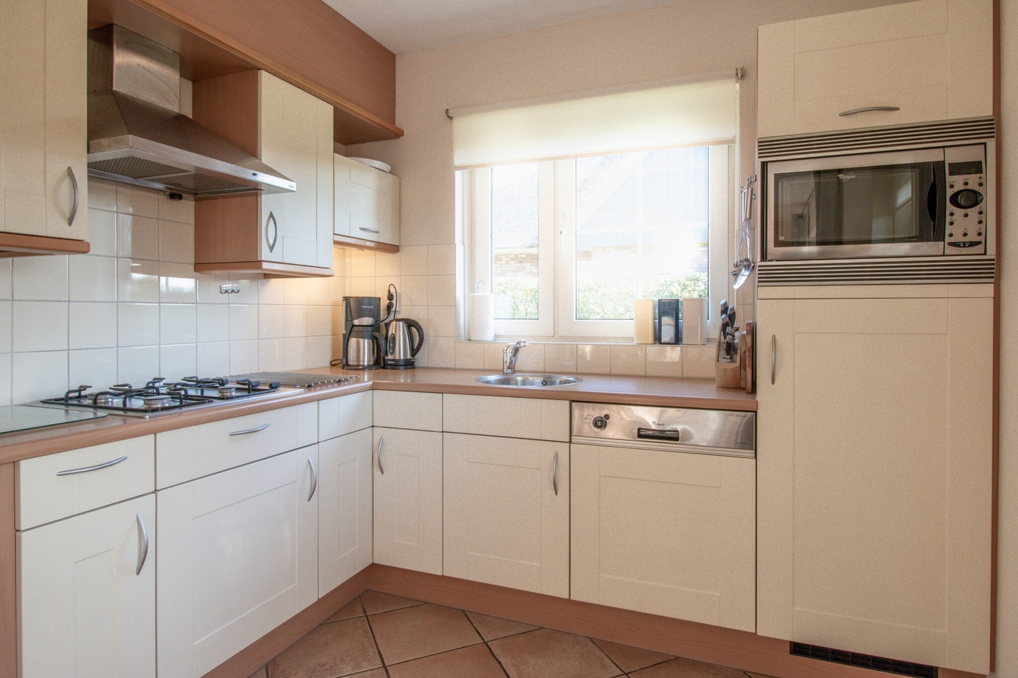 Ground floor: (Living room(TV(cable, flatscreen), seating area), dining room(dining table(6 persons)), open kitchen(stove(gas), electric kettle, toaster, coffee machine(filter), combination microwave, dishwasher), bathroom(shower, washbasin, toilet))\n\nOn the 1st floor: (bedroom(double bed(twin duvet, 160 x 200 cm)), bedroom(single bed(duvet, 90 x 200 cm), single bed(duvet, 90 x 200 cm)), bedroom(single bed(duvet, 90 x 200 cm), single bed(duvet, 90 x 200 cm)), toilet(toilet))\n\ntumble dryer, cot, washing machine, garden doors, patio, heating(central), terrace, garden, garden furniture, BBQ, parking, high chair, stair gate, Charging post for electric cars