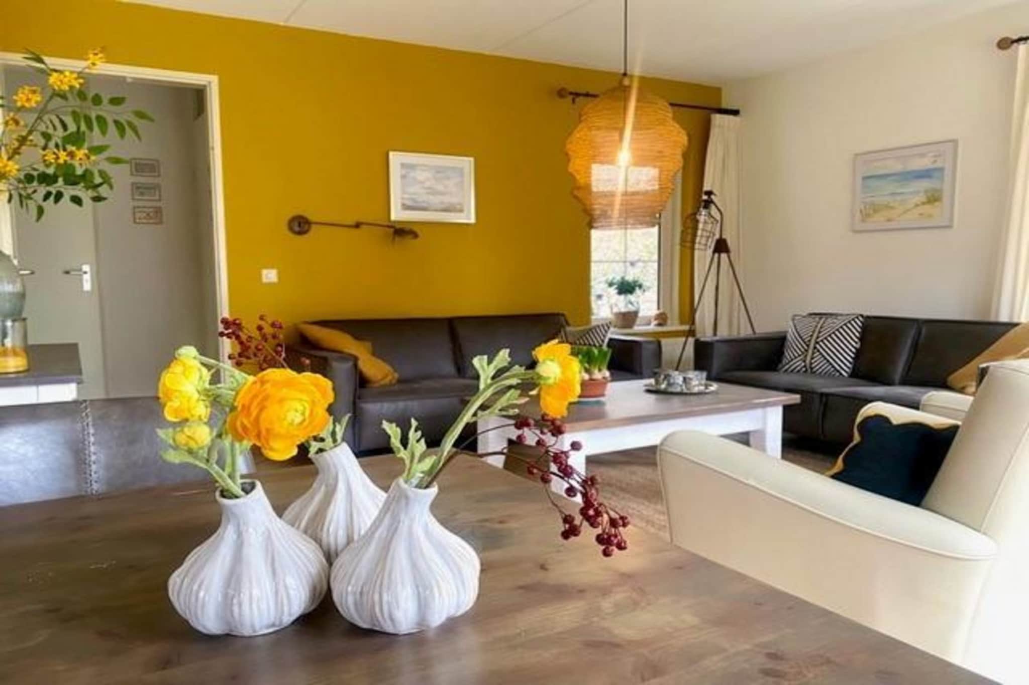 Totally unwind at the beautiful, small-scale Villapark Anzelhoef in Sint Maartenszee. In just 10 cycling minutes, you'll be on the beach, and the forest is merely a few minutes' walk away. This location is an ideal base for a cycling or walking holiday near the sea, or for a refreshing weekend break. The spacious and tastefully furnished living room features two comfortable sofas and cable TV with Dutch and German channels. The dining room boasts a large table with six chairs, and a high chair is available for little ones. The open kitchen is fully equipped, including a dishwasher, filter coffee maker, kettle, 4-burner gas cooker, and a combination microwave. For your convenience, a washing machine and dryer are at your disposal in the scullery._x000D_
_x000D_
Upstairs, you'll find three comfortable bedrooms, all with ample wardrobe space. All beds have single mattresses and duvets. A children's bed is also available; please remember to bring your own bed linen for the cot. The ground floor bathroom is equipped with a shower, toilet, and washbasin, with a second toilet located on the first floor for added convenience. Step through the garden door in the living room to access the sunny garden, featuring a beautifully landscaped terrace with garden furniture. Barbecuing is permitted on electricity or gas._x000D_
_x000D_
Parking space is available for one car at the accommodation, with additional cars able to park in the general car park. Please note that charging electric cars using the bungalow's electricity supply is not allowed. Enjoy free WiFi throughout your stay. Pets are not permitted in this accommodation._x000D_