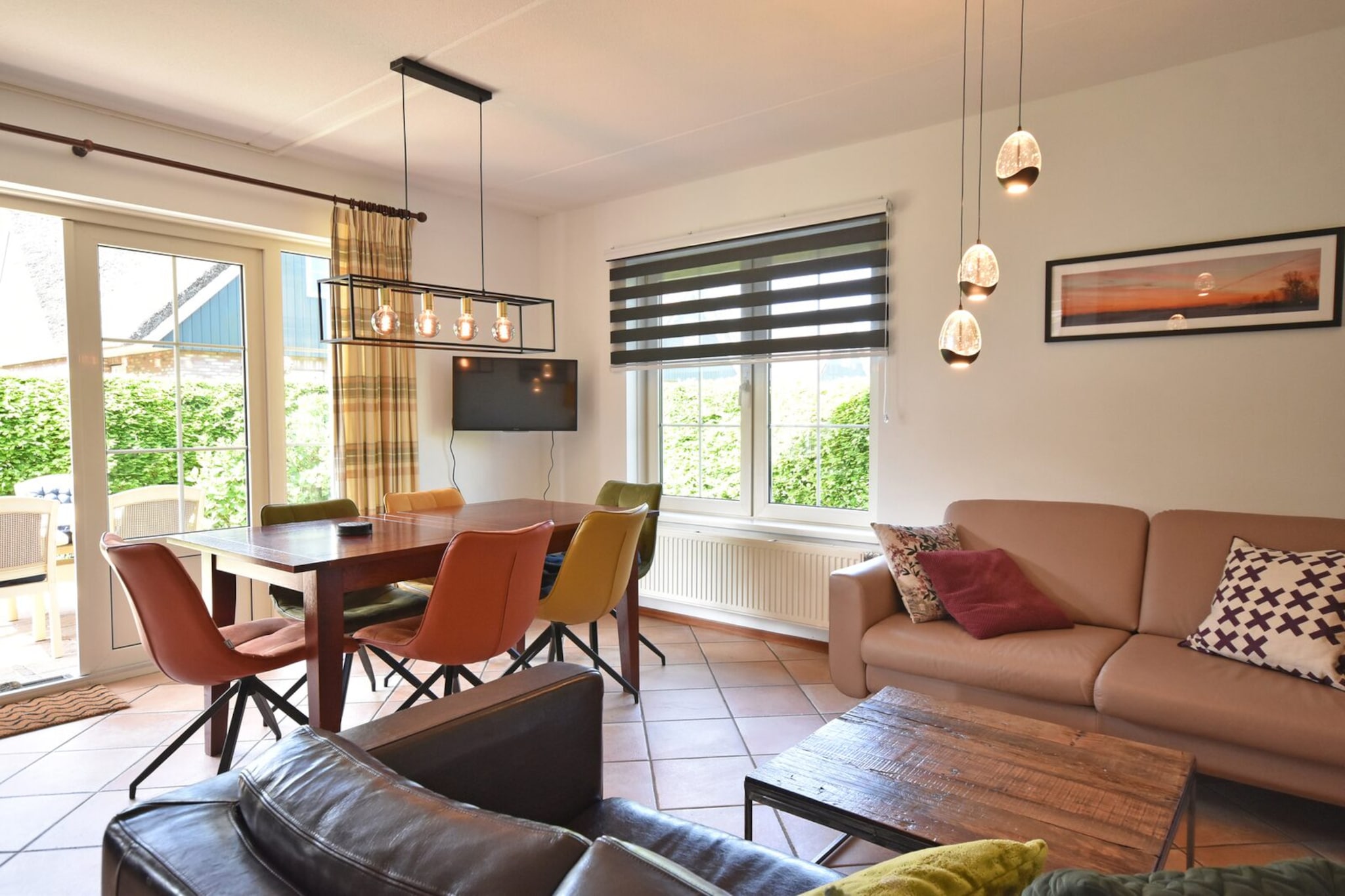 Escape to the charming villa in Sint Maartenszee, a tranquil haven where you can truly unwind. Located just a 10-minute bike ride from the beach and a short walk from lush forests, this is the perfect base for cycling or walking holidays or a refreshing weekend getaway.
Inside, the living room is a cozy retreat, furnished with two comfortable sofas and a spacious dining table that seats six, ideal for family meals or game nights. Enjoy entertainment from the cable TV with Dutch and German channels, and take advantage of the printer for all your needs. The open kitchen is fully equipped to satisfy your culinary desires, featuring a dishwasher, filter coffee maker, espresso machine, kettle, and a 4-burner gas cooker, along with a combination microwave and toaster. A high table with stools offers a casual spot to enjoy your morning coffee. In the utility room, a washing machine and dryer make stays effortless.
This delightful villa boasts three bedrooms: one on the ground floor with a double bed (160 x 200 cm), and two upstairs, each with its own spacious double bed (160 x 200 cm and 160 x 210 cm). All beds have single mattresses with duvets, ensuring restful nights. A cozy cot is available in one of the upstairs bedrooms, along with a chest of drawers. With two bathrooms and an additional separate toilet, convenience is assured. Step outside through the garden door to a sunny garden, featuring a beautifully arranged terrace perfect for relaxation. An electric barbecue is provided, allowing for delightful outdoor dining.
One car can park at the accommodation, while additional cars can use the general parking area. Pets are not allowed, and free WiFi is provided for your convenience.
Please note that linen is not included; you may bring your own or arrange to rent it when booking. Enjoy a memorable stay at this peaceful retreat near the sea!