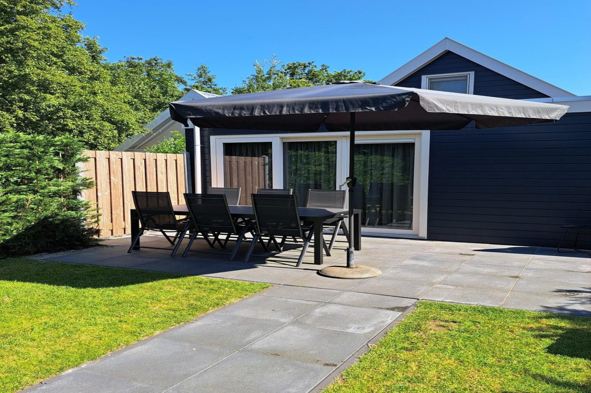 Welcome to this beautiful renovated holiday home in Bungalowpark "Belkmerduinen," completed in 2023. This modern and comfortable retreat is ideally situated on the edge of the central car park, just a short walk or bike ride from the sparkling sea and sandy beach.

Step inside to discover a spacious, open-plan kitchen, fully equipped for your culinary adventures. Featuring an induction hob, microwave, oven, fridge with a freezer, and dishwasher, this kitchen ensures you have everything you need to create delicious meals. The dining area flows seamlessly into a cozy living room enhanced by natural light and direct access to the sunny terrace through sliding doors.

The property boasts three inviting bedrooms. The ground floor features a master bedroom with a double box spring bed and ample wardrobe space. Upstairs are two additional bedrooms, each furnished with two single box spring beds and plenty of storage. The modern bathroom includes a washbasin, shower, and a second toilet, making it perfect for families or groups of friends.

Enjoy the enclosed sunny garden, where you can bask in the sun or retreat to a shaded terrace for relaxation. Additional amenities include free WiFi, a washing machine, a dryer, a cot, high chair, bicycle storage, and charging options for electric bikes. Please note that linen is not included in your booking; you may bring your own or rent it when you book. Pets are not allowed, ensuring a tranquil environment for all guests.

Note: The bed-linen is optional and available for â‚¬ 13 p.p./Stay.