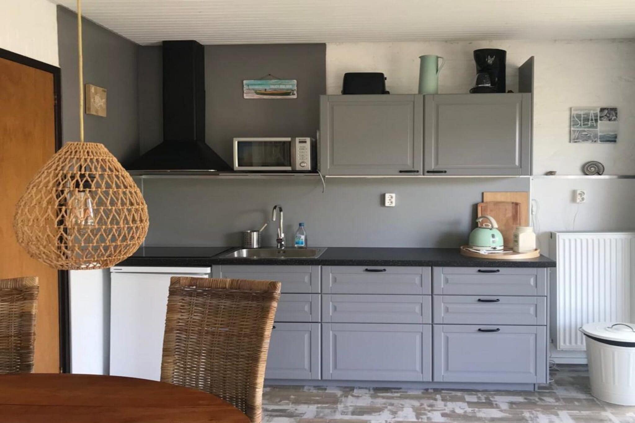 Ground floor: (Living room(TV(cable), seating area), dining room(dining table(4 persons)), open kitchen(hob(4 ring stoves, induction), electric kettle, toaster, coffee machine, microwave, dishwasher, fridge), bedroom(double bed box), bathroom(shower, washbasin), toilet(toilet))\n\nsauna, heating(central), terrace, garden(fenced), garden furniture, BBQ, parking, swimming pool(shared with other guests)