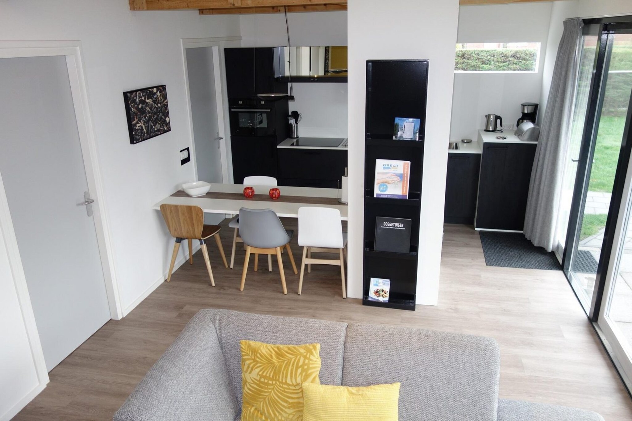 Just a short distance from the sea, dunes, and forest, this stylish holiday bungalow offers everything you need for a carefree getaway. Recently renovated and designed with comfort in mind, it’s a bright and welcoming place where you can truly relax and enjoy time together.

Inside, the open-plan living room and kitchen create a cozy heart of the home. The kitchen is modern and well-equipped, making it easy to prepare meals, while the lounge area is furnished with care—perfect for curling up after a day at the beach. Two comfortable bedrooms provide space for restful nights, and the bathroom feels fresh and luxurious. Free WiFi keeps you connected, though the peaceful setting might just tempt you to switch off completely.

Step outside and you’ll find a sunny terrace and a private, enclosed garden, where you can enjoy long afternoons in the fresh air. There’s even a special outdoor shower for your dog, so pets feel just as welcome as their owners. With so much space, comfort, and nature all around, this is a place where you can slow down, breathe out, and make holiday memories that linger long after you’ve returned home.

Note: The bed-linen is optional and available for € 13 p.p./Stay.