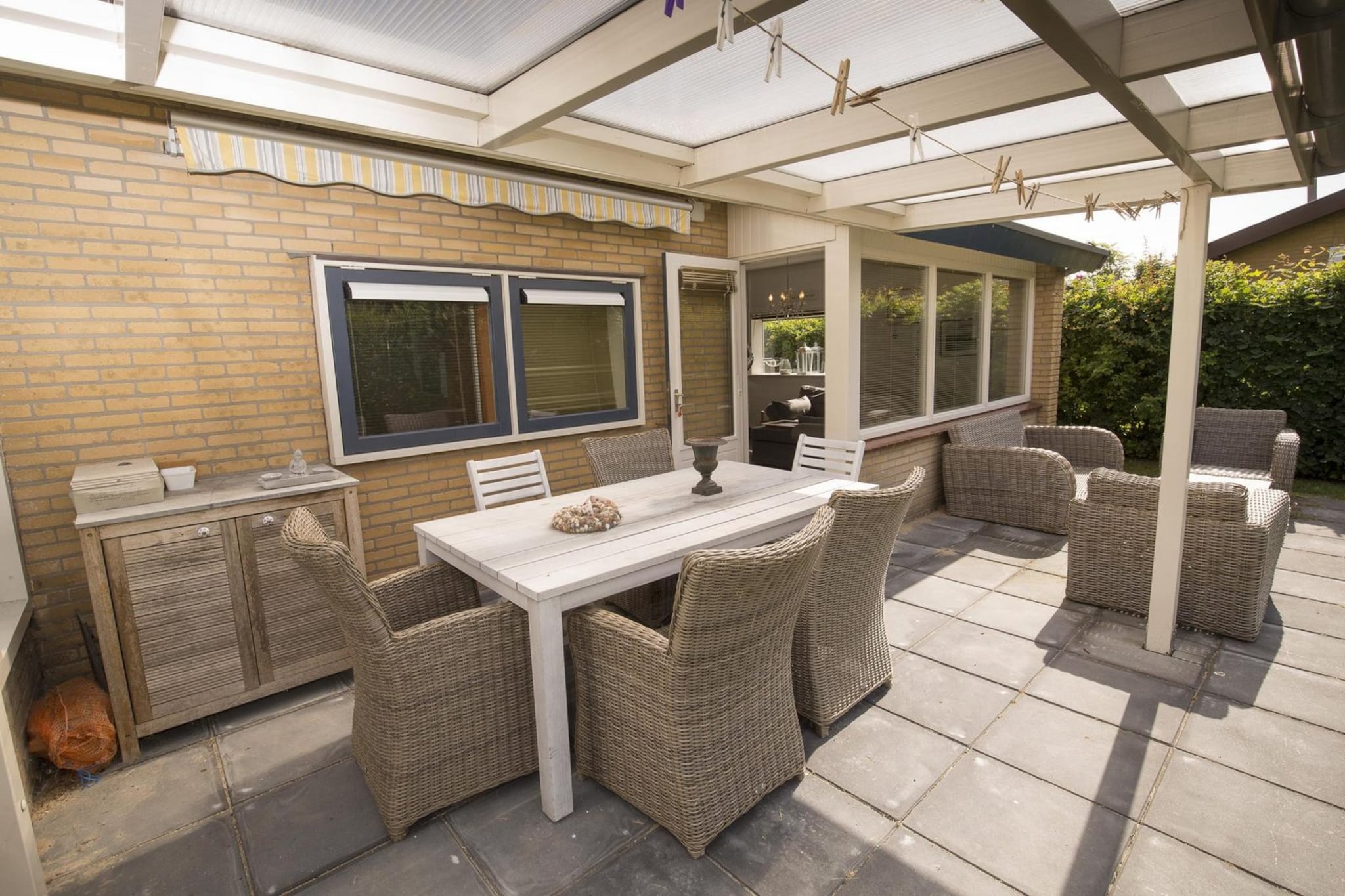 Ground floor: (Living room(TV(digital), fireplace, seating area), open kitchen(coffee machine, coffee machine, microwave, microwave, dishwasher, dishwasher, fridge-freezer, fridge-freezer), bedroom(double bed), bedroom(single bed), bedroom(bunk bed), bathroom(shower, washbasin, washing machine))\n\ncot, heating(central), garden, high chair