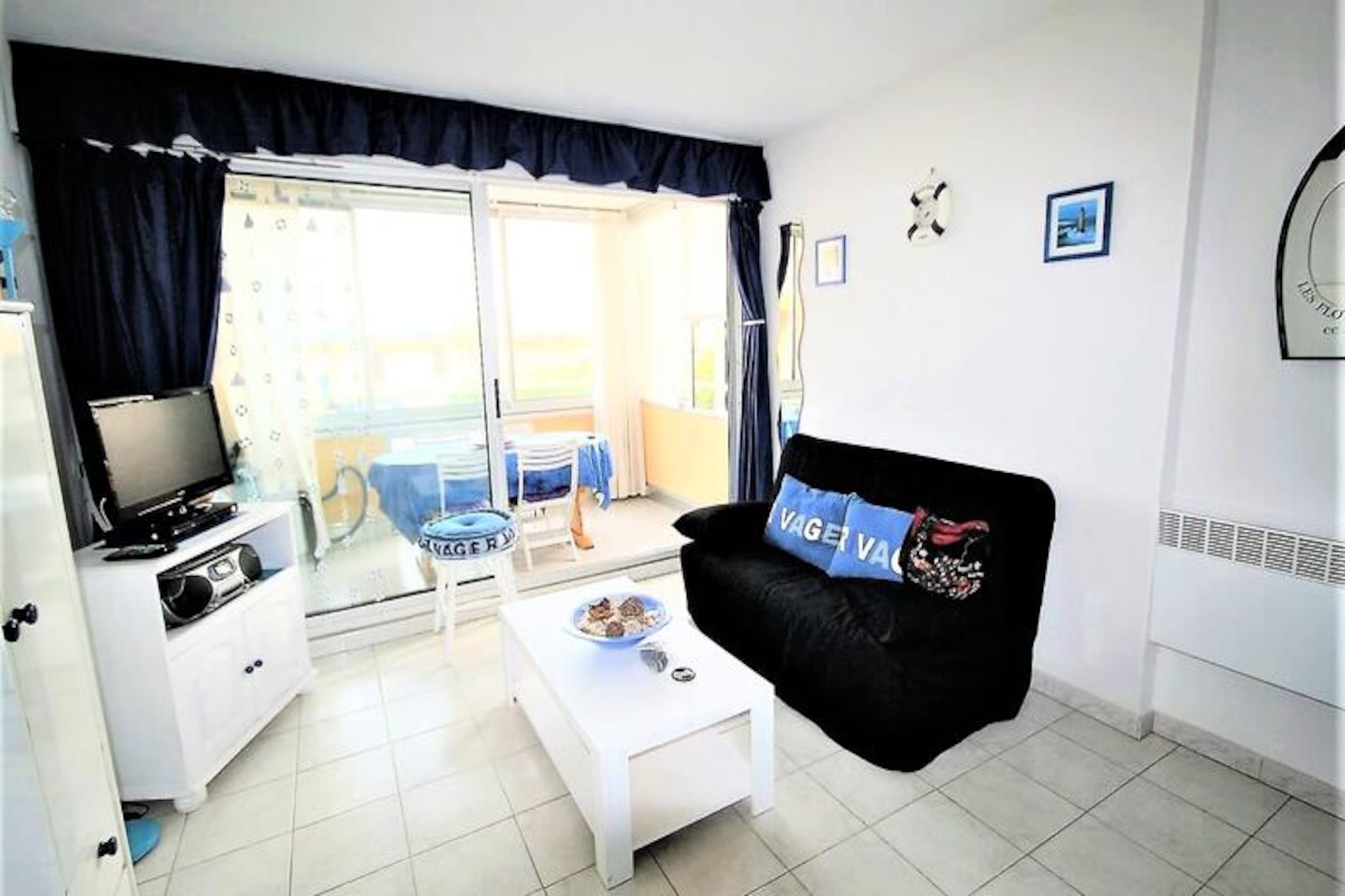 This charming T2 apartment offers a peaceful retreat with stunning sea views, perfect for a relaxing vacation by the beach. The property accommodates up to four guests with one bedroom featuring a 140 cm double bed and a cabin area with bunk beds. A spacious living room with a kitchenette provides a comfortable space to unwind, while the sea-view loggia offers a lovely spot for meals. Private parking is also available, ensuring convenience for your stay. The property is non-pet friendly, providing a serene environment for families or couples.

Located close to the port, the apartment places you near a sailing school and a variety of local attractions. You’ll also find shops, cafes, and markets within easy reach, offering a great selection of local goods and treats. Whether you’re looking to explore the water with some sailing or simply enjoy a peaceful stroll along the coast, this location offers the perfect balance of activity and relaxation.

Inside, the apartment is well-equipped with modern amenities including a television, fan, fridge/freezer, coffee maker, microwave, and washing machine. The bathroom and separate WC ensure comfort and convenience throughout your stay. Whether you’re cooking a simple meal in the kitchenette or enjoying the nearby dining options, this apartment offers everything you need for a memorable seaside vacation.