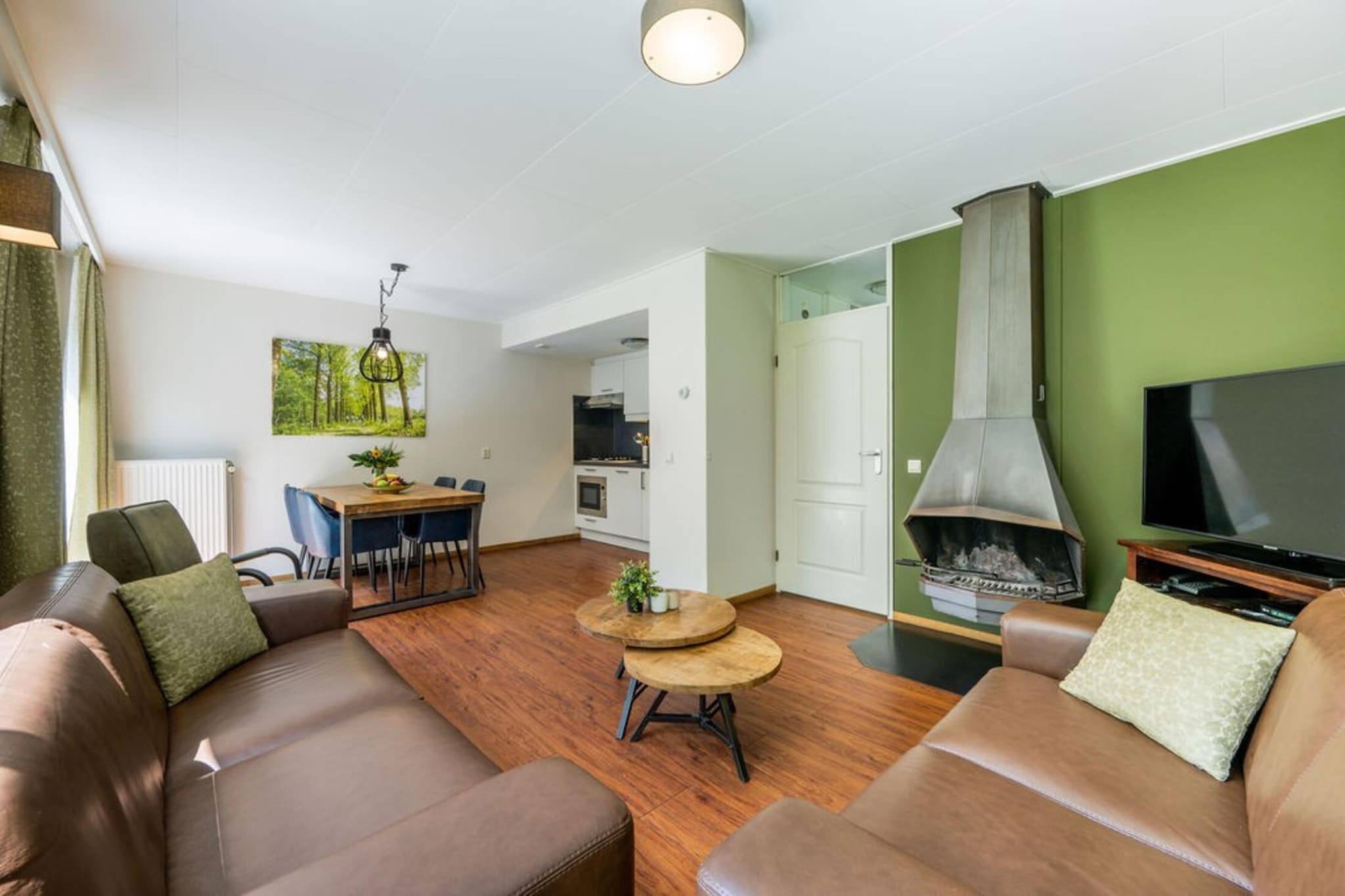 Indulge in the luxury and tranquility of this detached holiday home in Scherpenzeel, offering 103 m² of pure comfort and relaxation. Designed for families, it features two stylish bedrooms with twin boxspring beds (90x200 cm), ensuring a restful stay. The home boasts two modern bathrooms, including a private sauna for ultimate relaxation, a sunbed to unwind after a busy day, and a bathtub with soothing bubbles for a spa-like experience at home. The inviting living space, complete with a cozy fireplace, is perfect for relaxing evenings in.
Located in the heart of the Netherlands, the holiday home is close to two stunning national parks—De Hoge Veluwe and De Utrechtse Heuvelrug—ideal for hiking and cycling adventures. With attractions like Burgers Zoo (30 km), Ouwehands Zoo (22 km), and Zoo Amersfoort (18 km), along with nearby castles, museums, lakes, and playgrounds, there’s something for everyone to enjoy.
This home is equipped with all the modern comforts to enhance your stay. Enjoy entertainment with a flat-screen TV, DVD and Blu-ray players, and free Wi-Fi. The well-equipped kitchen includes a dishwasher, making it easy to prepare meals for the family. A separate toilet and central heating ensure convenience and comfort throughout your stay. The simple interior is complemented by sitting and dining furniture, creating a welcoming atmosphere.