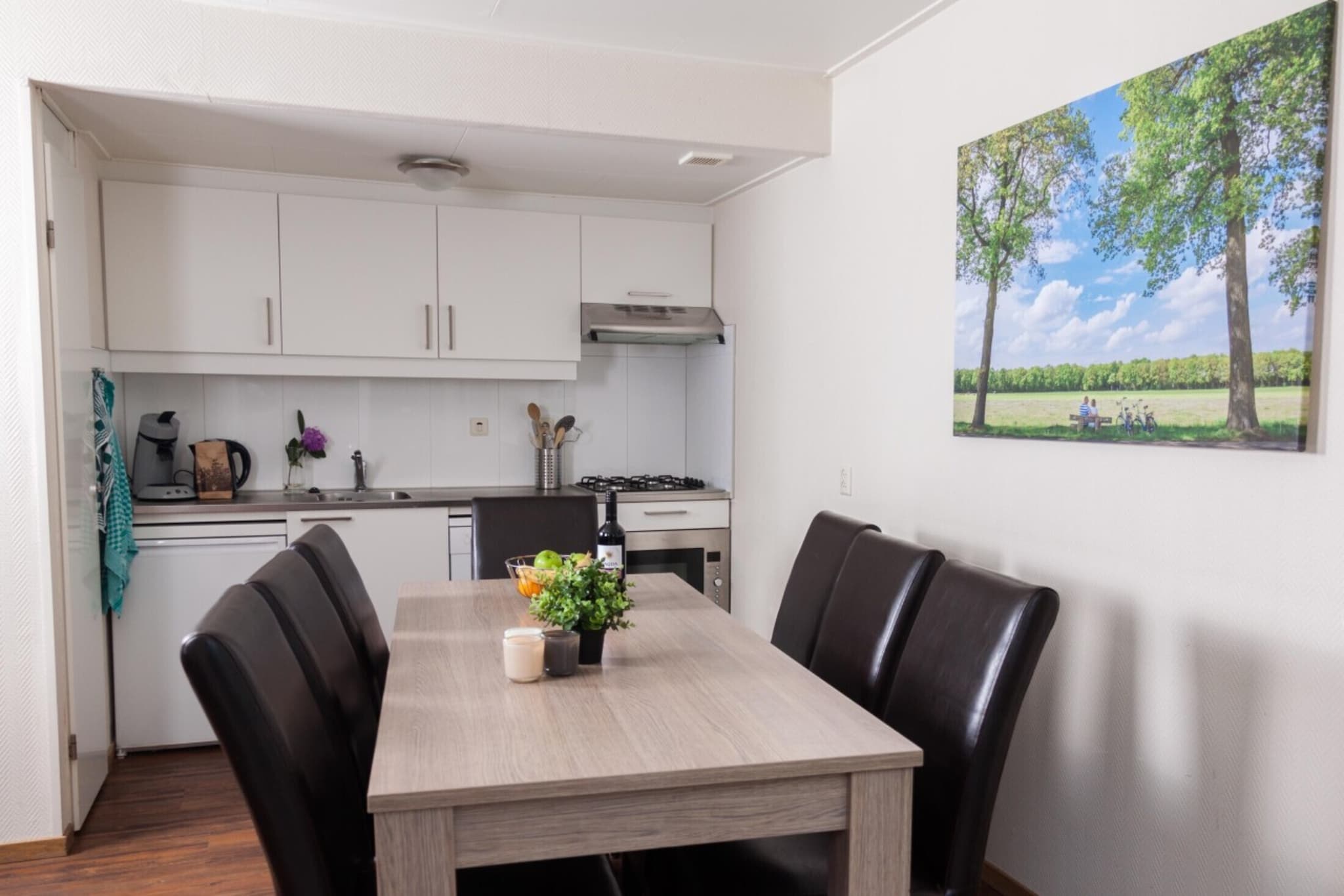 Ground floor: (open kitchen(electric kettle, coffee machine, combination microwave, dishwasher), Living/diningroom(TV(flatscreen), dining table, fireplace, seating area, Blu-ray player, telephone), bedroom(double bed or 2 single beds(duvet)), bedroom(double bed or 2 single beds(duvet)), bedroom(double bed or 2 single beds(duvet)), bathroom(bathtub with shower, washbasin, washbasin), bathroom(shower, washbasin, toilet), toilet(toilet), storage, Internet access)\n\ncot, patio, heating, garden furniture, high chair, stair gate