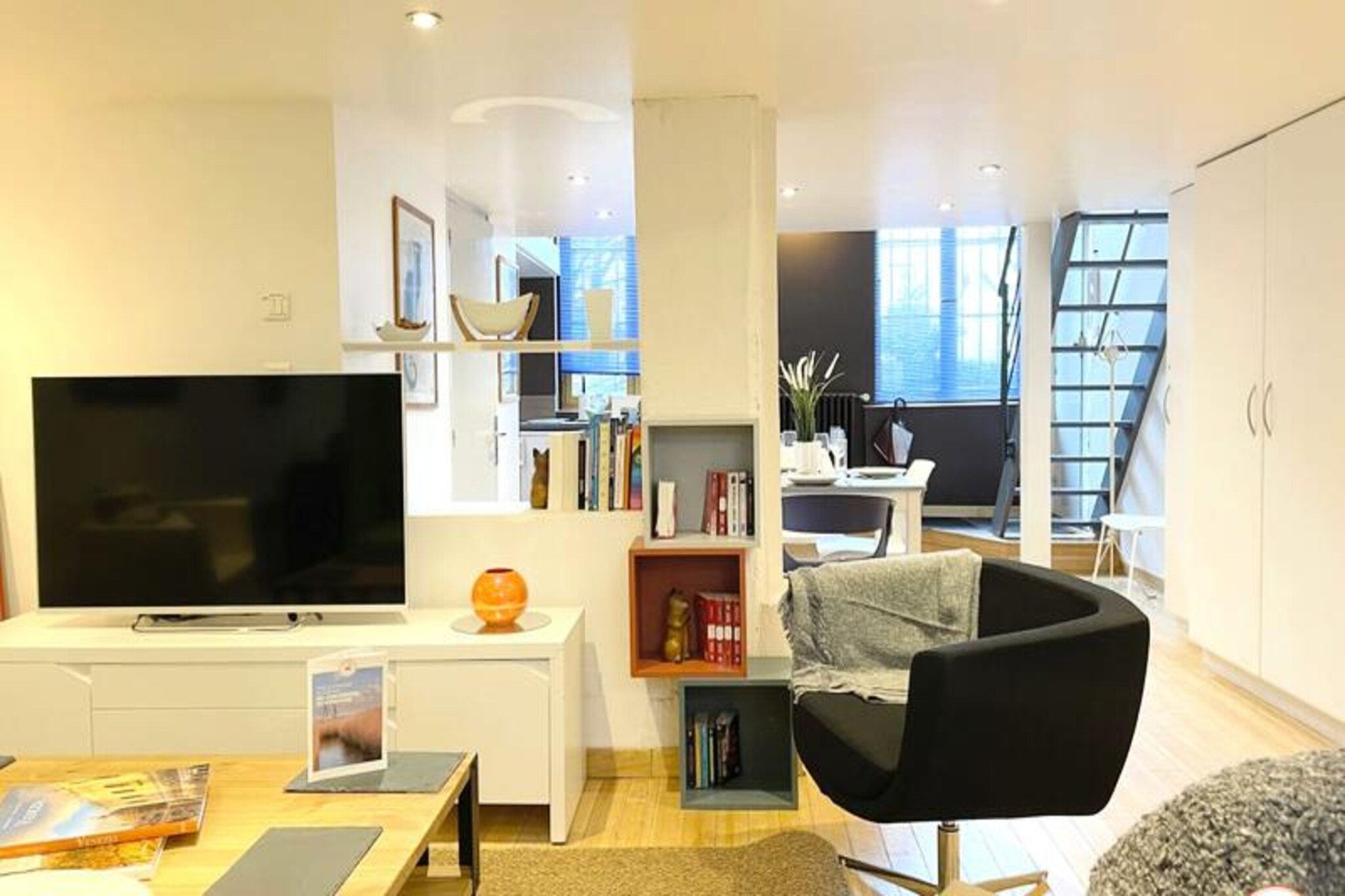 Located in the heart of Rouen, this stylish loft accommodates up to four guests, offering an exceptional blend of comfort and unique design. The ground floor features a fully equipped American-style kitchen with a dining area, and a cozy living room with a Smart TV for entertainment. Upstairs, the spacious bedroom boasts a queen-size bed, and a second bedroom offers two single beds. A small, modern shower room with a WC is also available. The loft includes bed and bath linens, free WiFi, and a private parking space upon request. Please note, the property is not pet-friendly.
Ideally located, the loft is just a few steps from the town hall and within walking distance of Rouen’s most iconic attractions, such as the Big Clock and Old Market Square. The city’s vibrant cultural scene, cafes, and shops are all easily accessible, allowing you to explore the charm of Rouen at your leisure. The apartment provides a peaceful retreat amidst the bustling city, offering the best of both worlds.
Inside, the loft’s open-plan layout creates a spacious and comfortable living area. The kitchen is equipped with a fridge, oven, induction hob, and coffee machine, perfect for preparing meals. The apartment is ideal for those looking to enjoy the city while having a relaxing and well-equipped place to return to. Please be aware that breakfast is not included, and the apartment follows strict rules regarding noise and neighborhood respect.