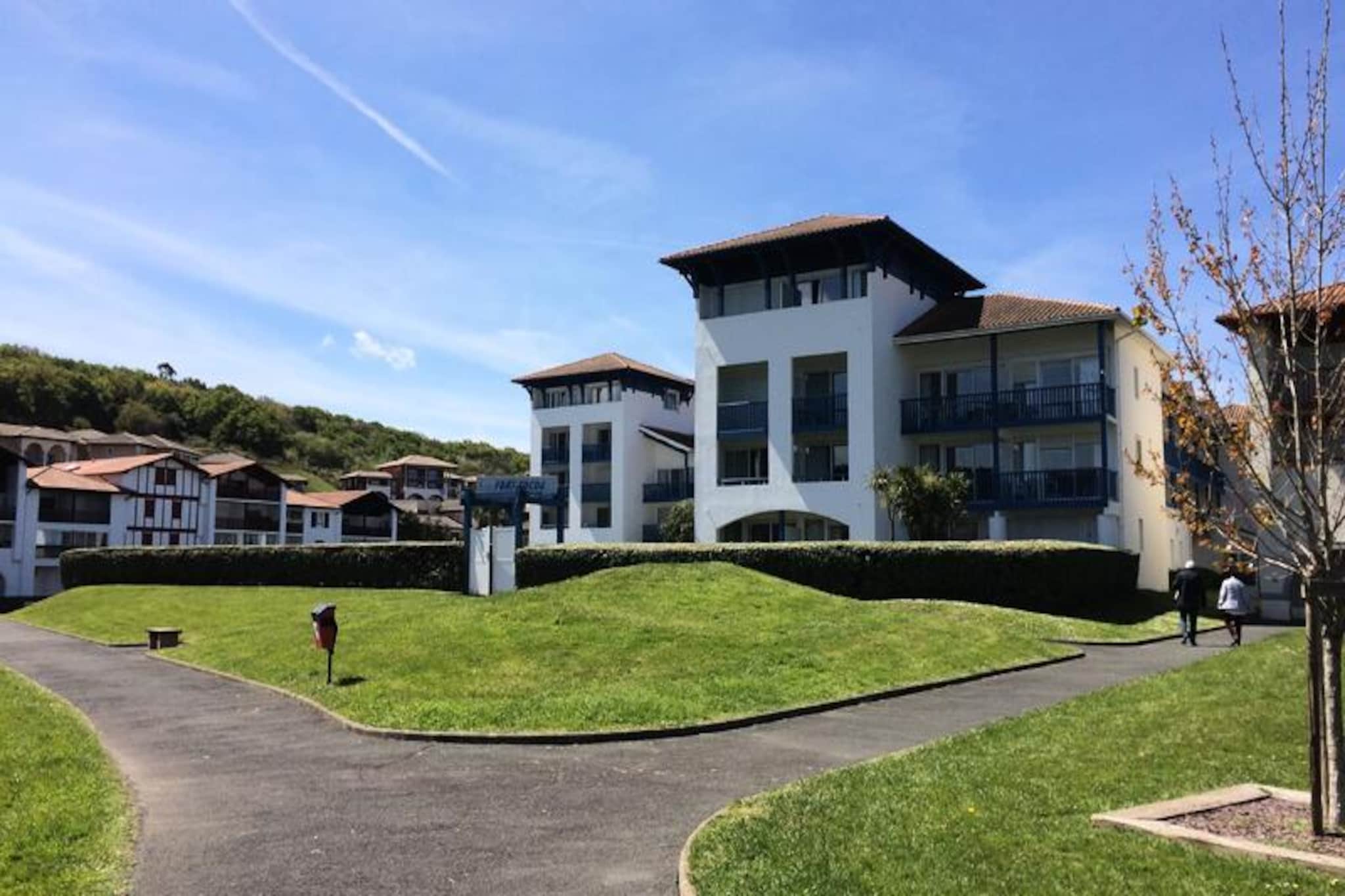 The Sea & Residence Golf Fort Socoa*** is located on the banks of the Untxin River, at the end of the Bay of Saint-Jean-de-Luz. You will find the fine sandy beach of Socoa and the shops just 400m away. . You can take a stroll in the city center which is only 3.5km away.
The residence has an outdoor swimming pool and a paddling pool open in summer, bicycle and windsurfing rooms. For leisure, you will find on site a games room with billiards and table football (fee payable) and an outdoor ping-pong table (loan of rackets and balls).
The residence is located close to many activities such as an 18-hole golf course, tennis courts, a thalassotherapy center, the possibility of surfing... 20m from the Residence, you will find a playground for children as well as a health trail.
The advantages of the Residence:
- In the family resort of Urrugne, a few minutes from Saint-Jean-de-Luz
- 400 m from the fine sand beach of Socoa and shops
- Ideal starting point to discover the entire Basque Country: coast, inland areas and Spain
- Swimming pool and shaded patio
- Free public parking
- 20m from a fitness trail and a children's play area
- Preferential rates (surfing, golf, etc.)
Nestled at the bottom of the bay of Saint-Jean-de-Luz, known for the calm of its waters, the small and typical family resort of Urrugne, bordered by a large sandy beach, will constitute the ideal starting point for discovering all the facets of the coastal and inland Basque Country
Please note:
The number of occupants cannot exceed the maximum capacity authorized in the accommodation.
A baby counts as a person in its own right for insurance purposes.
Even with a baby bed, it cannot exceed the maximum capacity authorized in the accommodation.
For example, 2 adults and 1 baby will not be able to stay in a studio 2, but in a studio 4 or a 2-room apartment.
5 adults or 2 adults and 3 children + 1 baby must stay in accommodation for 6 people, etc.
No extra beds allowed.
Minimum 1 adult per accommodation.
3 Rooms 6 People. Terrace or loggia.
Living room with convertible sofa for 2 people or 2 single sofa beds.
Equipped kitchen.
2 bedrooms with double bed or 2 single beds.
Separate bathroom and toilet.
Please note: some apartments are split level.
Wifi access - Free Basic Access Wifi access (consulting email and internet access) at reception, in the lounges and accommodation (3 devices maximum simultaneously)
Pets allowed - 7€/night (up to 6 nights); €45/week; €75/2 consecutive weeks; 100€/3 consecutive weeks; 120€/ 4 consecutive weeks (with valid anti-rabies certificate)
Deposit (additional) - 200
Baby Kit - (folding bed standard NF EN 716 and 1 house sheet for 1 child under 15kg + high chair from 6 months): 6€/night (per night up to 3 nights); €20/ stay from 4 nights
Bed linen - included
Towels - included (1 bath mat per bathroom/shower + 2 bath sheets + 2 hand towels)
End of stay cleaning - excluding kitchen area and dishes - €48 to €110; depending on the typologies, included for short stays up to 4 nights / supplement of 50€ for cleaning the kitchen area and dishes
Parking - free
Breakfast - Bakery service (bread and pastries)
Swimming pool - outdoor open in summer + paddling pool (open from April to November)
Breakfast service - served in the dining room - 9€/adult (from 12 years old) and 6€/child (between 4 and 11 years old)
Tourist tax (additional charge) - to be paid on site according to the current rate
Television - included