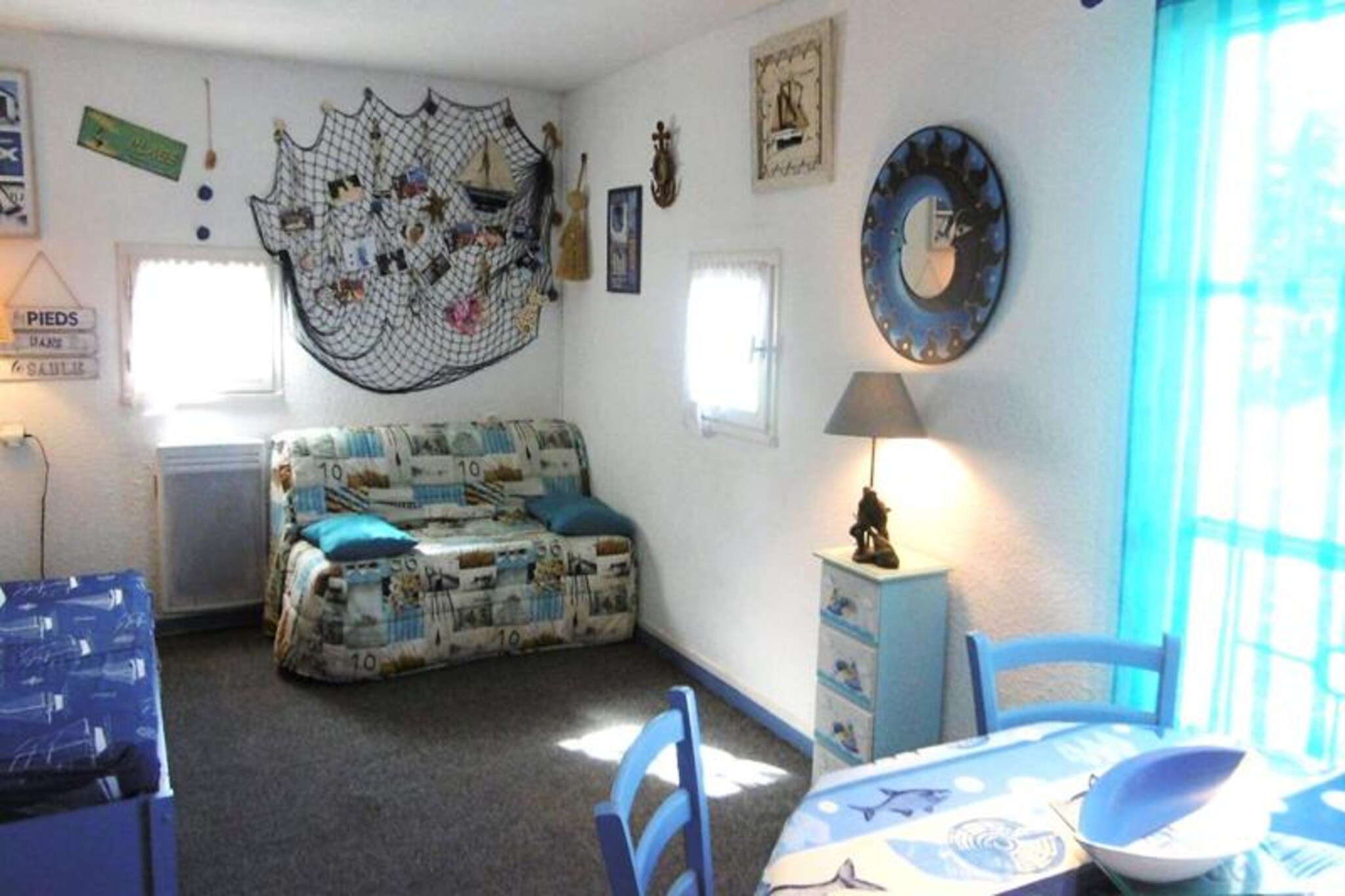 This 21m² studio apartment, located on the first floor of a residence (no elevator), comfortably accommodates up to three guests, with a BZ-type sofa bed for two and a separate sofa bed for one. Pets are welcome for an additional weekly fee. Private parking with free spaces is available.

Situated in the Bretagne Douce district of Arzon-Port du Crouesty, the studio is just 300m from the beach and offers direct access to Thalassotherapy. An unheated outdoor collective swimming pool is open from July 1st to August 31st. The description doesn't detail specific nearby attractions, shops, or restaurants beyond the beach and thalassotherapy center, implying these are within easy reach.

The studio features a living room with the sofa beds, an equipped kitchenette, and a bathroom with a bathtub and toilet. A television is included. Bed linen and bathroom linen are not provided but are available for rent. Wi-Fi is also not included but can be rented. Departure cleaning is the tenant's responsibility, though a cleaning package can be booked. Electricity is charged based on meter readings during certain periods. A deposit and tourist tax are payable on-site. Baby equipment is available for rent. Heating is available.