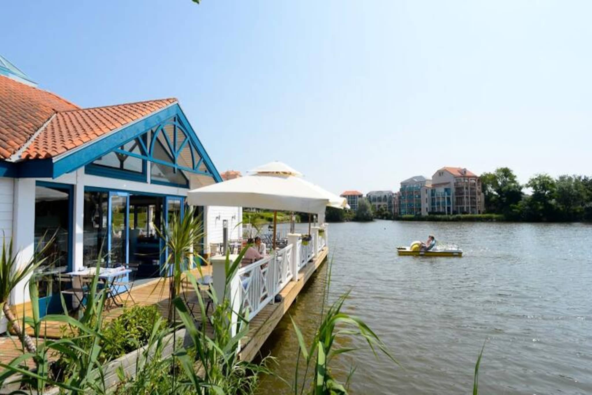 This duplex apartment, located in a peaceful 90-hectare estate, offers a comfortable stay for up to 6 people. It includes two bedrooms—one with a double bed and the other with bunk beds—along with two bathrooms and two toilets. Pets are allowed for an additional fee, and baby kits are available upon request. The apartment features a balcony with a south-facing view of the golf course, and guests can enjoy the convenience of an outdoor parking space. Please note that WiFi is available for an extra charge.
Situated just 2.5 km from Veillon Beach, this holiday home is ideal for beach lovers and outdoor enthusiasts. The residence provides access to several hiking areas and a shuttle service to the beach. Guests can enjoy various leisure activities including two 18-hole golf courses, tennis, mini-golf, and a swimming area with slides and paddling pools. Nearby attractions include the bustling city of Les Sables-d’Olonne, only 9 km away, and multiple local restaurants and shops.
The apartment comes fully equipped with a semi-open kitchen featuring a mini-oven, microwave, dishwasher, and fridge. Two bathrooms provide ample space, one with a bathtub and another with a shower. The living room is furnished with a sofa bed, a flat-screen TV, and a coffee table, offering a cozy spot to relax after a day of exploring. For added convenience, a washing machine and end-of-stay cleaning service are available for an additional charge.