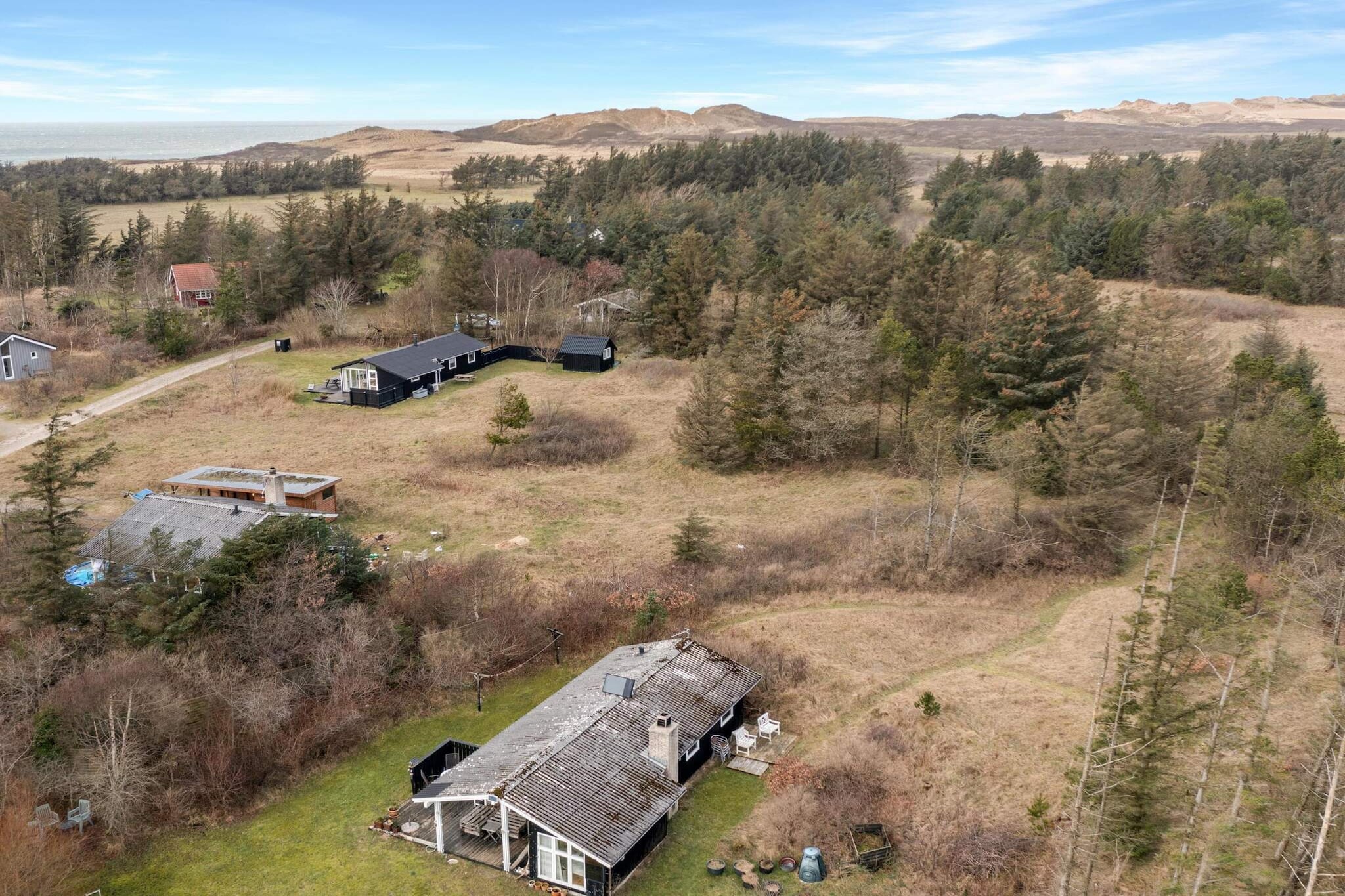 Nestled in the tranquility of the forest, this charming cottage offers the perfect retreat for those seeking peace and relaxation. The cozy living room features a lovely wood-burning stove, setting the scene for warm, relaxing evenings. The open-plan layout extends into the dining room and kitchen, making it easy to connect and enjoy meals together. The cottage has two inviting bedrooms—one with a double bed and the other with two single beds—ideal for families or small groups. Whether you're spending time inside or enjoying the serene garden, this cottage provides a peaceful escape from everyday life.
The garden offers a secluded spot for sunbathing during the mild Danish summer, and on cooler days, the inviting rooms inside provide the perfect atmosphere for relaxation. For those who love the outdoors, the beach is just a short 600-meter walk away, offering a beautiful place to unwind by the water. While shopping options are a bit further at 2.5 kilometers, the location still offers a quiet, rural escape with easy access to everything you need.
This non-smoking cottage is the ideal getaway for families or couples looking to enjoy nature while still being close to local amenities. Youth groups are not allowed, ensuring a peaceful and serene environment for all guests. Book your stay at this lovely cottage and enjoy the calming beauty of the forest and nearby beach.
A refundable deposit might be charged closer to your check-in date. This deposit covers utilities consumed during your stay and any additional services that may be taken. The final amount will be adjusted based on actual meter readings, actual usage of extra services, and any remaining balance will be refunded within 21 days after checkout.