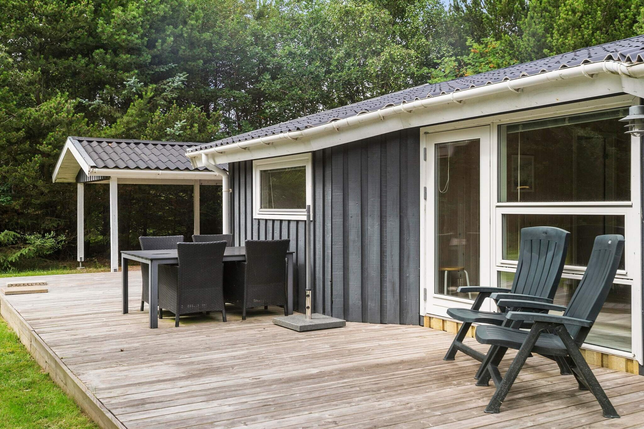 This charming Danish cottage offers a warm and welcoming atmosphere, perfect for families or small groups. The open-plan kitchen, family room, and living room create a cozy gathering space where you can relax by the wood-burning stove or enjoy a meal at the dining table. Large windows open up to a beautiful natural setting, allowing you to enjoy the serene surroundings. The cottage features three bedrooms, including one with a bunk bed and a loft bed for up to three people, while the other two bedrooms each have double beds, accommodating up to 7 guests. The large bathroom also includes a sauna, adding to the cottage's comfort.

Lille Fiskerbanke is a family-friendly retreat located at the end of a quiet cul-de-sac, providing a private and peaceful environment. The spacious garden is perfect for children, with a swing set and sandpit, surrounded by lush trees. The property’s location places you close to Jambo Holiday Park, Fårup Sommerland, and beautiful beaches, ensuring a wide variety of activities for everyone. Whether you prefer outdoor adventures or a relaxing day at the beach, the cottage offers the ideal base for your Danish holiday.

The nearby towns of Løkken and Blokhus offer even more attractions, with shopping, restaurants, and additional family-friendly activities. Whether you’re seeking nature walks, thrilling amusement parks, or simply relaxing in a tranquil setting, this cottage provides the perfect balance of convenience and seclusion. The combination of a spacious, private outdoor area and close proximity to popular attractions makes this holiday home an exceptional choice for a memorable family getaway.

A refundable deposit might be charged closer to your check-in date. This deposit covers utilities consumed during your stay and any additional services that may be taken. The final amount will be adjusted based on actual meter readings, actual usage of extra services, and any remaining balance will be refunded within 21 days after checkout.