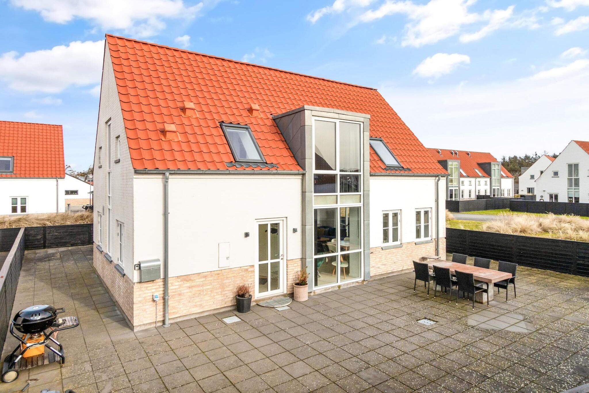 This charming holiday home offers a cozy and stylish retreat in the heart of Løkken, perfect for a stay with up to 6 guests. The house features three bedrooms, including two with double beds and one with a single bed and pull-out option for an additional double bed. On the first floor, you'll find the bedrooms and a bathroom, while the ground floor boasts a spacious entrance hall, another bathroom, and a beautiful kitchen that flows into a large, bright living and dining area. With its luxurious and comfortable furnishings, the house exudes a welcoming atmosphere. The property is non-smoking, and youth groups are not allowed.
Located just 750 meters from one of Denmark's finest beaches, this holiday home is ideally situated for those who want to enjoy both relaxation and adventure. The central location in Løkken places you close to shopping, restaurants, and attractions, including a swimming pool and fitness center. Surrounded by scenic nature, this property offers easy access to all the best that the town has to offer, making it a perfect base for exploring the area.
The property is set in a tranquil neighborhood, with a terrace that wraps around the house, ensuring you can always find a sunny spot to relax. The lovely outdoor area offers the perfect setting for enjoying the warm weather, whether you're dining al fresco or simply unwinding in the fresh air. With beautiful nature surrounding you and the beach just a short walk away, this home is the ideal place for a memorable getaway.
A refundable deposit might be charged closer to your check-in date. This deposit covers utilities consumed during your stay and any additional services that may be taken. The final amount will be adjusted based on actual meter readings, actual usage of extra services, and any remaining balance will be refunded within 21 days after checkout.