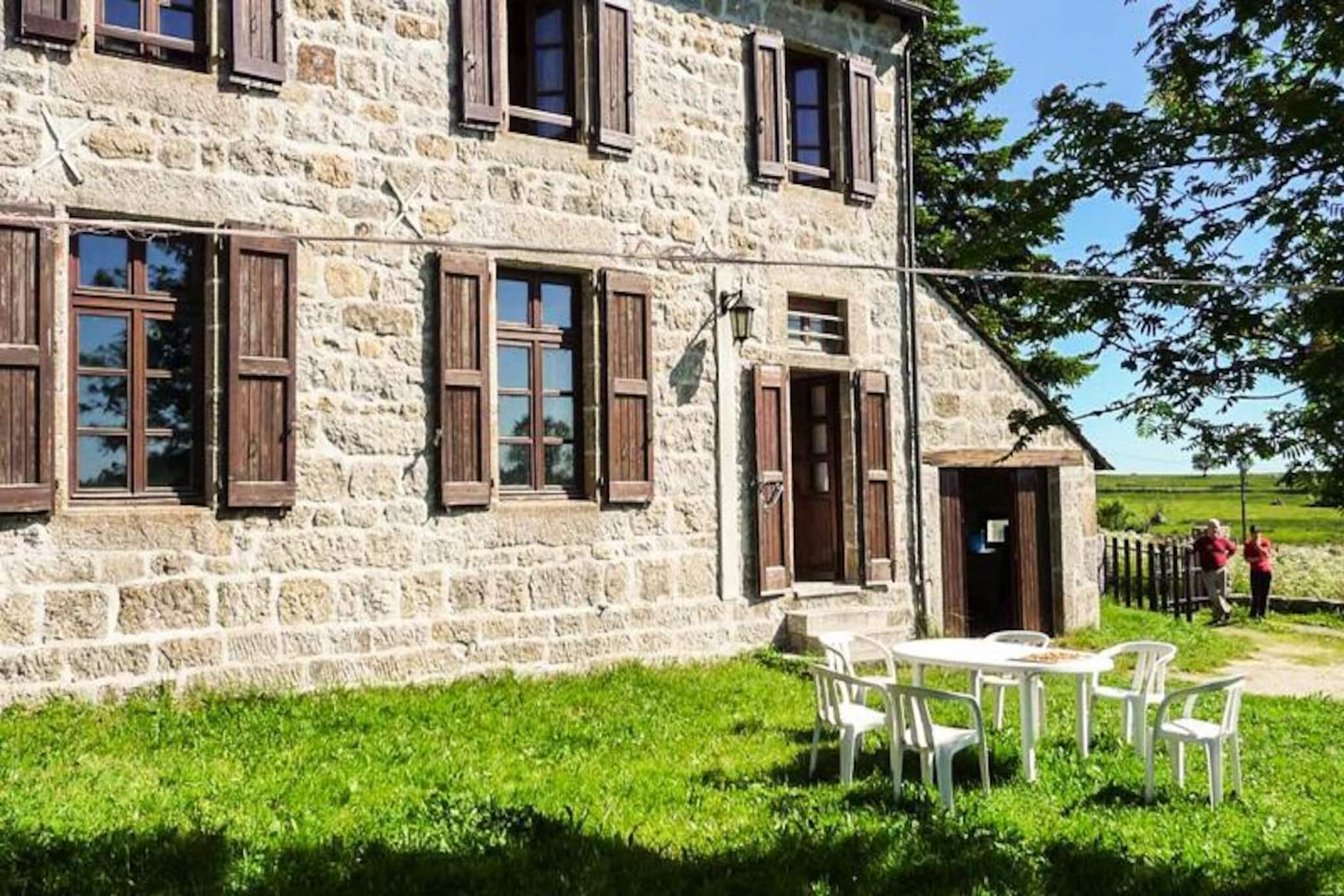 This renovated holiday home, a charming former schoolhouse, offers a cozy and welcoming atmosphere for up to six guests. The property features three bedrooms, two with double beds and one with two single beds, making it ideal for families or small groups. A baby cot and highchair are available for added convenience. Guests can enjoy the warmth of a fireplace with wood provided, and pets are welcome at no extra cost. The property includes a private, enclosed courtyard with a garden lounge and barbecue, as well as a garage and private parking for your vehicles.

Located in a serene setting, this holiday home is an excellent base for exploring the surrounding region. The nearest swimming pool is just 15 km away, while local markets, cafes, and shops are within easy reach for sampling regional delicacies and crafts. Outdoor enthusiasts will find a variety of walking trails nearby, offering picturesque views of the countryside. The area provides the perfect mix of tranquility and activity for a memorable stay.

The fully equipped kitchen includes a refrigerator, microwave, dishwasher, and washing machine, ensuring a comfortable self-catering experience. A bright living area with a dining space and fireplace is perfect for relaxing after a day of exploration. The first floor features a modern bathroom with a shower and an additional WC, while a separate WC is available on the ground floor. Free Wi-Fi keeps you connected throughout your stay.










