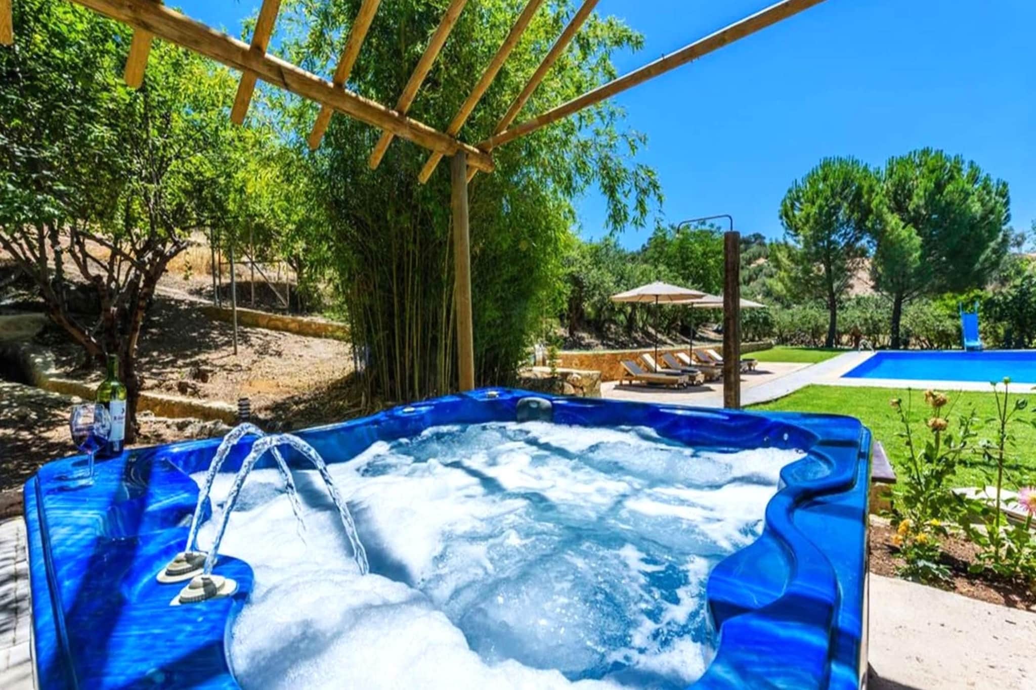 Ground floor: (Entrance(reachable from the outside), Living room(TV(smart TV), dining table, fireplace, seating area), open kitchen(hob, electric kettle, toaster, hood, coffee machine, oven, microwave, dishwasher, fridge-freezer, dishes and cutlery), open kitchen(hob, toaster, hood, oven, microwave, dishwasher, fridge-freezer, dishes and cutlery), Living/diningroom(double sofa bed, TV(smart TV), dining table, fireplace, seating area), bedroom(single bed, single bed), bedroom(double bed(150 x 190 cm)), bathroom(shower, washbasin, toilet), bathroom(shower, washbasin, toilet, bidet), Internet access, air conditioning, terrace, heating)\n\nOn the 1st floor: (bedroom(double bed(150 x 190 cm)), bedroom(double bed(135 x 190 cm)), bedroom(double bed(135 x 190 cm)), bedroom(single bed, single bed, double bed(135 x 190 cm)), bedroom(single bed, single bed, single bed, double bed(135 x 190 cm)), bathroom(bathtub with shower, washbasin, toilet, bidet, hairdryer), air conditioning, heating)\n\nhot tub, garden, garden furniture, BBQ, parking, deckchairs, parasol, swimming pool(private, outside, 18 x  9 m., opened from May upto and including Oct), slide, table football, darts, high chair, ironing board, iron