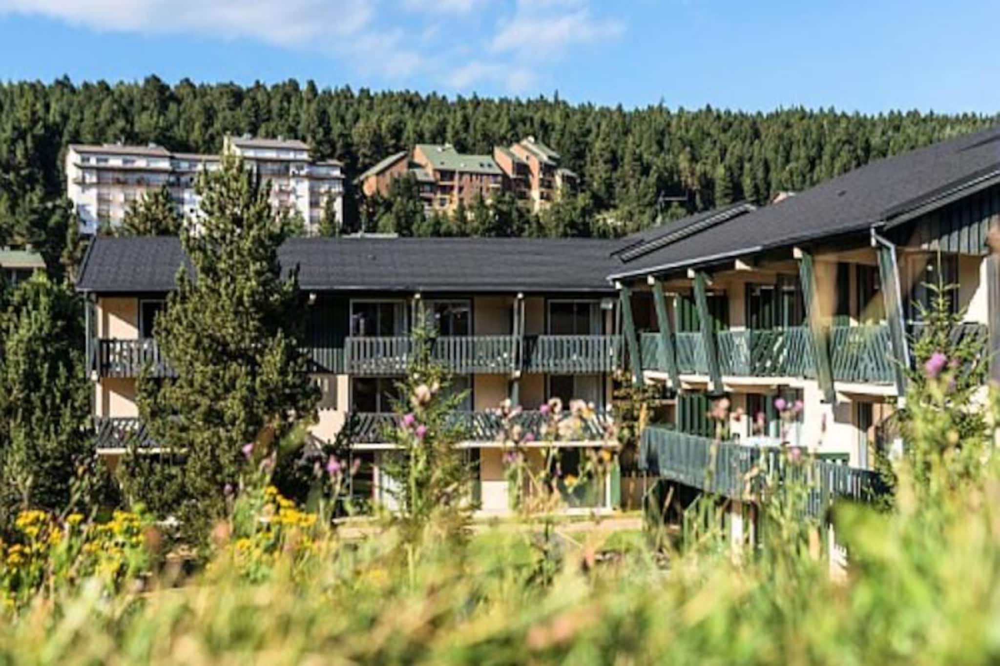 The Le Sequoïa residence is located in the heart of the Catalan Pyrenees. Located in Pyrénées 2000, at an altitude of 1800 meters, you are at the foot of the slopes.
Shops and entertainment are only 300 meters from the residence.
1 living room, 1 sleeping area, 1 kitchen area, 1 bathroom with 1 WC and 1 private parking space within the residence.
Living room equipment: 1 convertible sofa bed (sleeps 2) and 1 sleeping area with 1 single bed. Meal side: a table with 2 chairs and 2 stools.
Bathroom equipment: 1 shower with 1 WC.
Equipment in the kitchen: Kitchen area open to the living room.
Terrace equipment: a round table, 2 chairs and 1 wooden bench.
Surface area: 17 m².
The advantages of this accommodation: studio on the ground floor, at the foot of the slopes, ski locker, heating, storage, furnished terrace, TV...
maeva Home Confort label: good value for money.
Correct services, accommodation maintained and equipped with the main amenities. The essentials for a vacation at the best price.
Wifi access - Subject to availability - with supplement.
Pets allowed - 65 € / animal / week. 10 € / animal / day (stays of 1 to 6 nights).
Baby Kit - Subject to availability, à la carte equipment, may vary depending on the residence: bathtub, night light, food processor, deckchair - with supplement.
Bed linen - Included - content may vary depending on the residence: fitted sheet, sheet or duvet cover and pillowcase.
Towels - Extra charge.
End of stay cleaning - Mandatory cleaning service to be paid upon check-in or upon arrival.
Parking - Free with 80 spaces located within the residence - subject to availability.
Indoor swimming pool - Indoor swimming pool in Targassone located 8 km from the residence - with supplement.
Tourist tax (additional charge) - To be paid from your customer area, amount varies depending on the location. Free for under 18s.
End of stay cleaning - Mandatory cleaning service to be paid upon check-in or upon arrival.