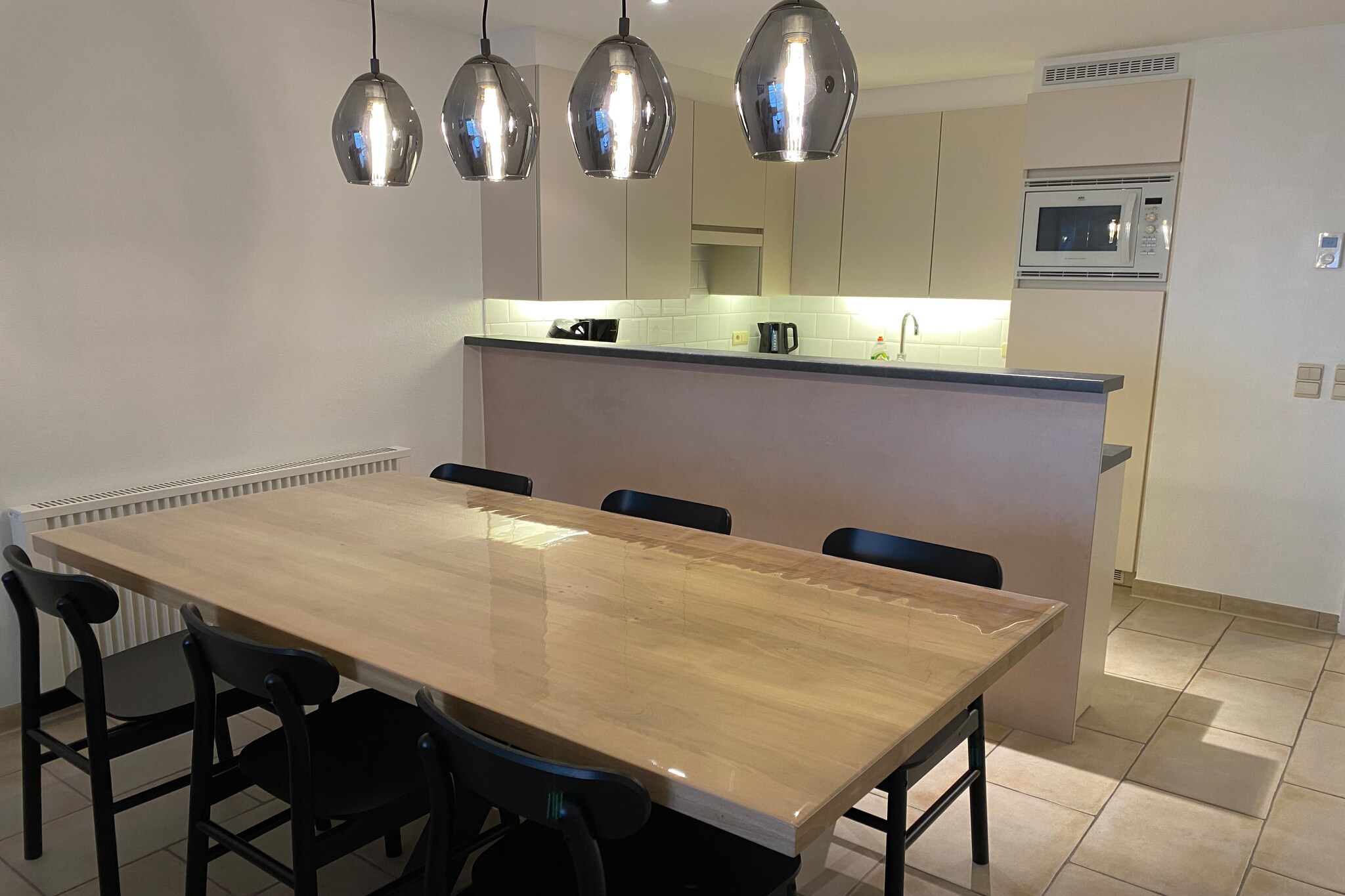 On the 3rd floor: (Living room(TV(digital), dining table, seating area), open kitchen(hob, electric kettle, coffee machine, combination microwave, dishwasher), bedroom(double bed(twin duvet, 160 x 200 cm)), sleeping niche(bunk bed(duvet)), bathroom(bathtub with shower, washbasin), toilet(toilet))\n\nterrace, bicycle storage, lift