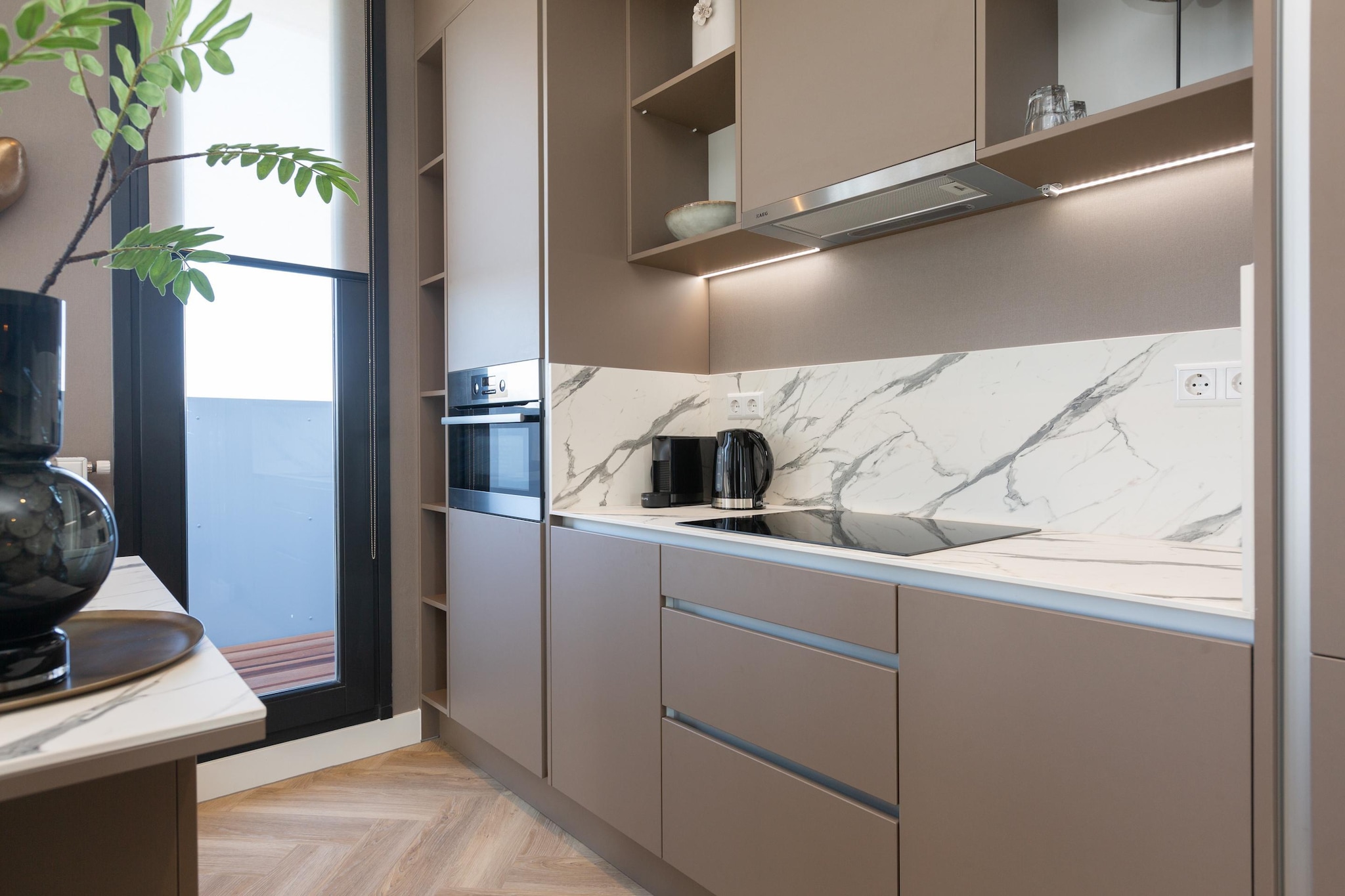 Ground floor: (Living room(TV(smart TV), seating area, chromecast), open kitchen(hob, hood, coffee machine, combination microwave, dishwasher, fridge-freezer, dishes and cutlery, Cooking basics), pantry(washing machine), bedroom(double bed box), bedroom(double bed box), bathroom(shower(walk-in shower), washbasin, toilet), bathroom(shower, washbasin, toilet), Internet access)\n\ntumble dryer, washing machine, balcony, heating, air conditioning, parking, hairdryer