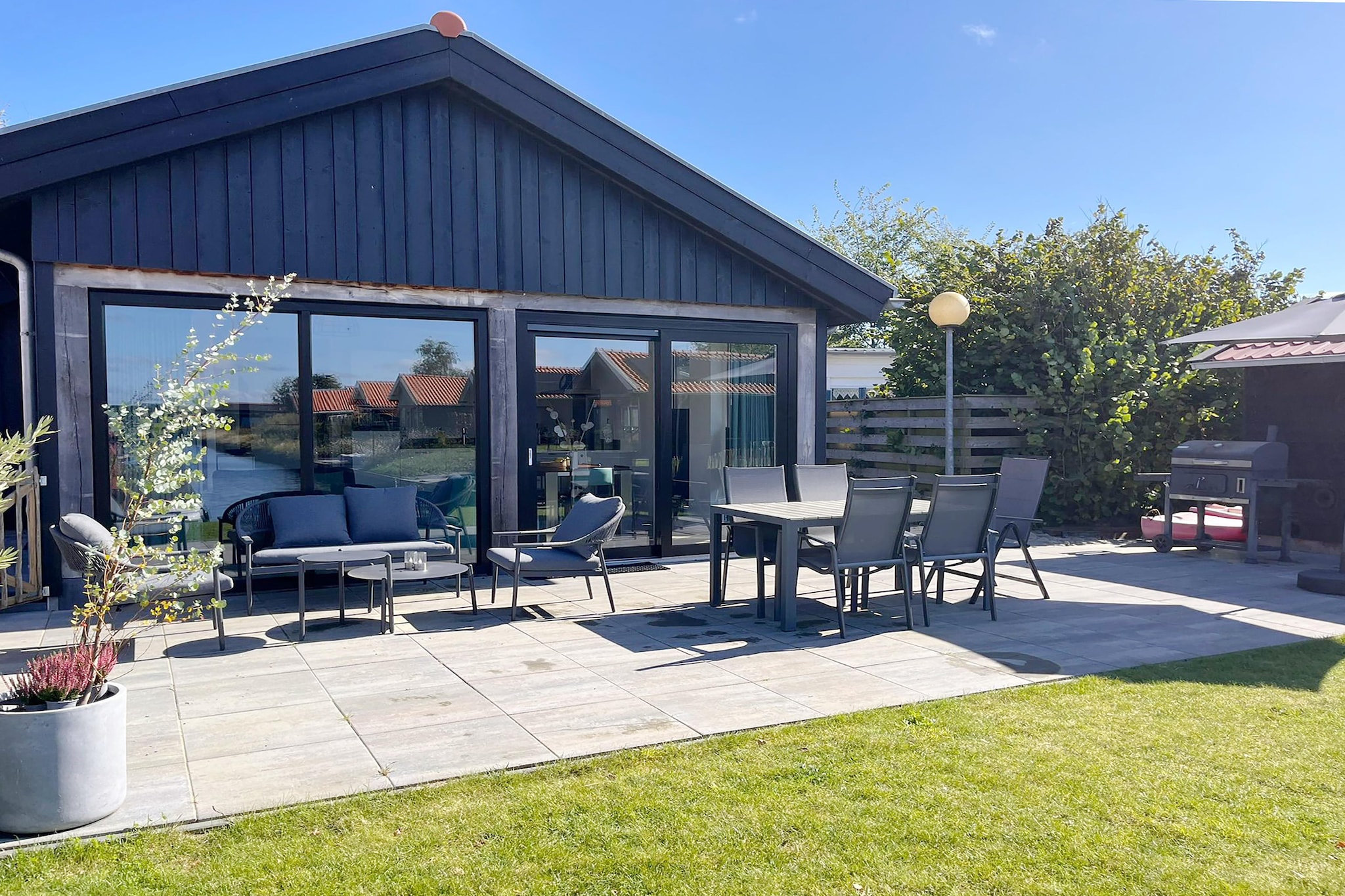 Ground floor: (Living room(TV, dining table, seating area), open kitchen(electric kettle, coffee machine, espresso machine, oven, microwave, dishwasher, fridge), bedroom(double bed), bedroom(single bed, single bed), bathroom(shower, washbasin), toilet)\n\nsauna, garden doors, terrace, garden, garden furniture, sun loungers, parking, parasol, Garden shed