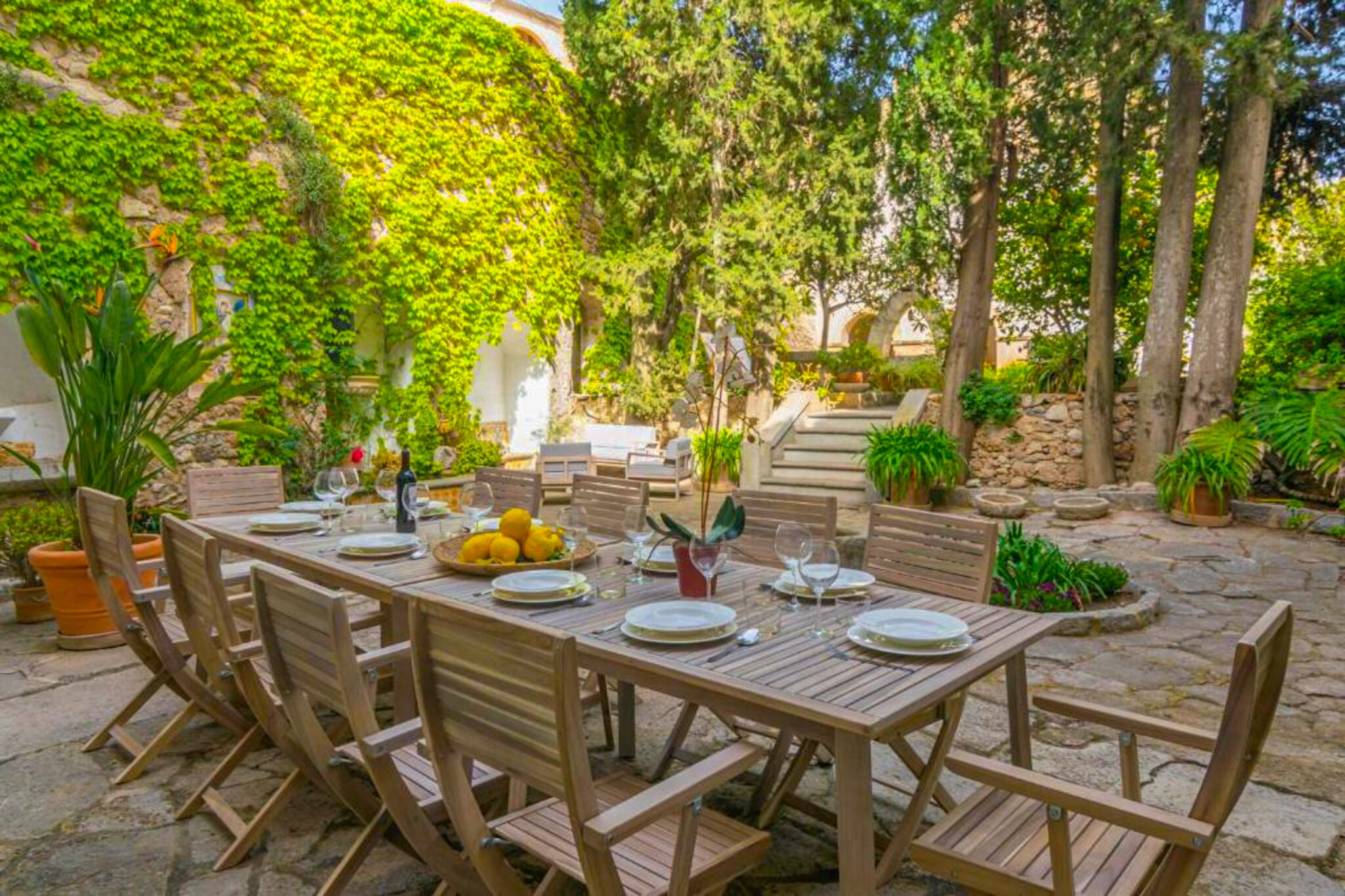 This charming holiday home, Llullana offers a perfect blend of comfort and convenience, making it an ideal getaway for up to 9 guests. The property features 4 spacious bedrooms, each thoughtfully furnished with cozy beds and equipped with fans to ensure a restful nightâ€™s sleep. The house also offers 4 modern bathrooms, providing ample space for all guests. Additional amenities include air conditioning throughout, Wi-Fi, a Smart TV for entertainment, and a cozy living area with plenty of seating. While the property is not pet-friendly, it provides everything you need for a comfortable stay, including a lovely interior patio surrounded by lush plants for peaceful outdoor moments.

Located in the heart of a vibrant town, the holiday home is just steps away from a range of local attractions. Explore the charming streets of the town, where youâ€™ll find quaint cafes, delicious restaurants, and the bustling weekly market. For those who enjoy history and culture, the local church with panoramic views of the town is a must-visit. The property is also just a short drive away from stunning beaches, including Cala Mesquida and Cala Agulla.

Inside, the house offers a fully equipped kitchen, perfect for preparing home-cooked meals using fresh local ingredients. The kitchen includes a refrigerator, microwave, oven, and dishwasher, along with all the necessary utensils. The property also features a comfortable dining area where guests can gather for meals, and a cozy living room for relaxation.
The rental license number is ETV/8036