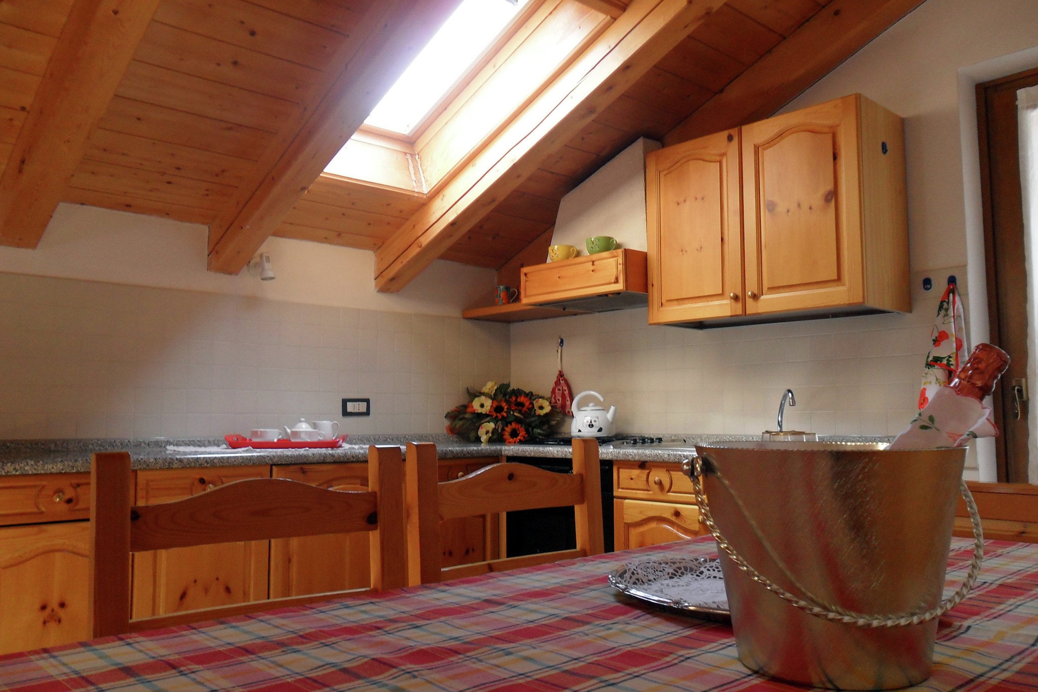 Ground floor: (open kitchen(dining table, oven), Large kitchen(double sofa bed, TV), bedroom(2x single bed), bedroom(2x single bed), bathroom(shower, washing machine))\n\nsauna(paid), garage, heating(central), terrace, garden(shared with other guests), garden furniture, BBQ