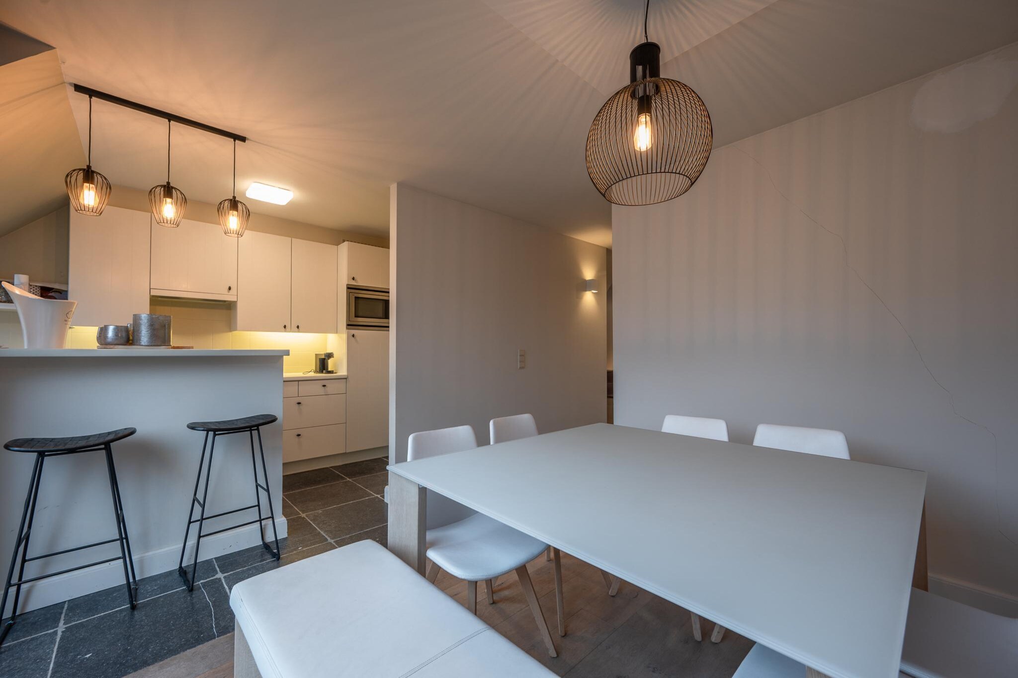 This fantastic contemporary duplex, located in the heart of Knokke-Heist on the Parmentierlaan, is just steps from the Zeedijk and the vibrant center of the town. With every comfort you could need, this stylish apartment is the perfect retreat for a relaxing getaway by the sea.

Located just a short walk from the beach, this duplex places you in the perfect position to explore Knokke-Heist. Stroll through the lively town center with its charming boutiques, cafes, and restaurants. Visit the beautiful Zwin Nature Park, ideal for nature walks, or head to the Knokke Casino for entertainment. With its modern amenities and prime location, this duplex is the perfect base for your coastal escape.

On the ground floor, youâ€™ll find a spacious and welcoming living area. The living room opens onto a beautiful terrace where you can enjoy the morning sun, while the kitchen and dining space lead to a second terrace with afternoon sun, perfect for evening relaxation. The fully equipped kitchen includes a dishwasher, oven, microwave, and induction hob, making meal preparation a breeze. Upstairs, youâ€™ll discover three cozy bedrooms: one with a double bed and an en-suite shower, another with a double bed, and the third a smaller room with two single beds. A separate bathroom with a bath completes this floor, providing all the comforts for your stay. A very spacious garage in the courtyard offers convenient parking, along with bicycle storage, perfect for exploring the area on two wheels.

Kindly note that the booking is subject to the hostâ€™s approval. The host will reach out to you shortly to confirm the details.

