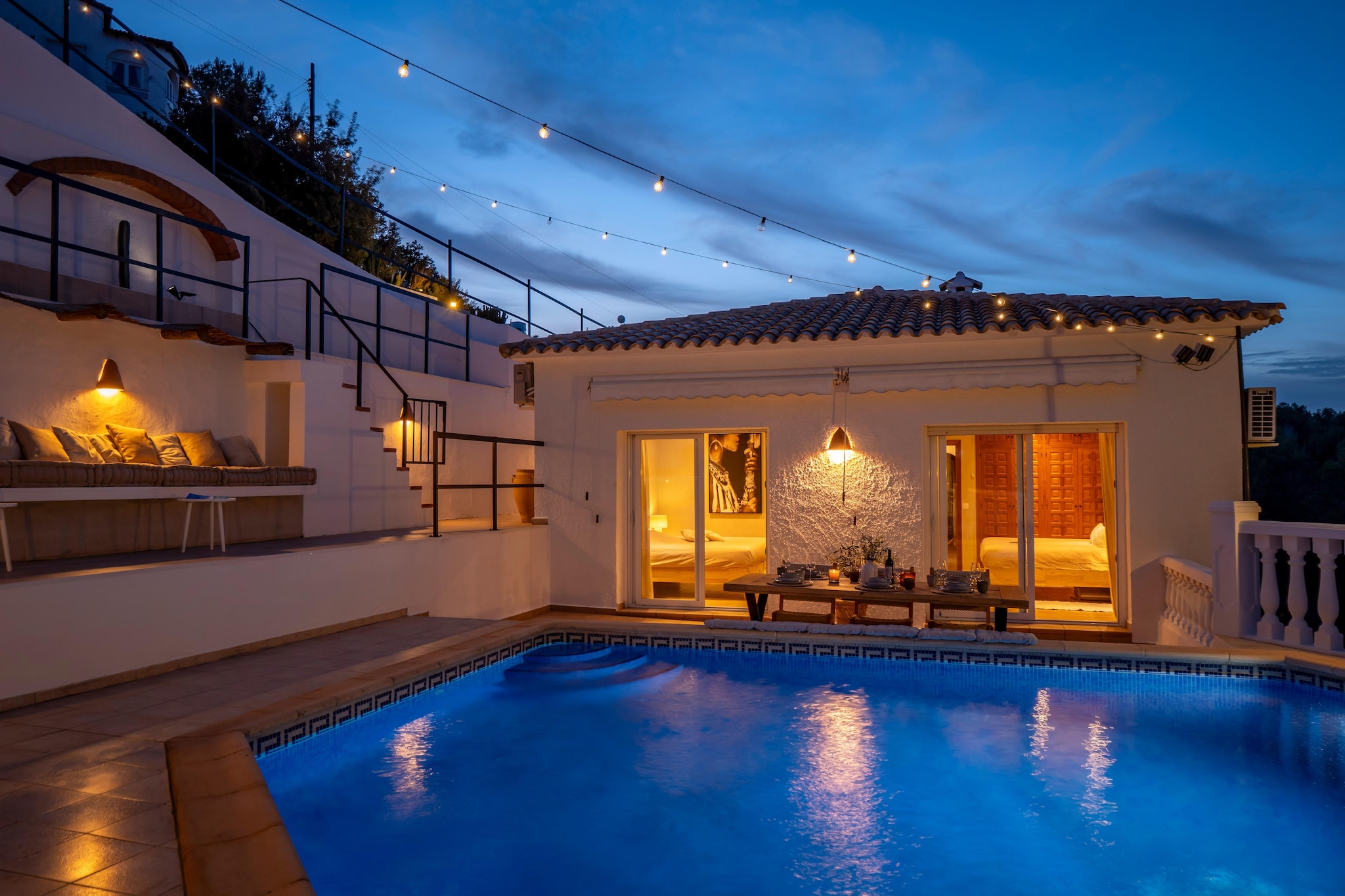 Hidden on a peaceful hillside where olive trees sway in the breeze and the Mediterranean shimmers in the distance, Villa Solana is a place where quiet feels like luxury. This charming hideaway invites you to slow down, breathe deeply, and let time unfold to the rhythm of nature. With its private pool, sunlit terrace, and barbecue area overlooking the valley, every moment here feels unhurried and serene. It’s a retreat designed for families or small groups who crave privacy, comfort, and the beauty of the Spanish countryside.

Inside, the villa balances rustic charm with contemporary comfort. Three restful bedrooms, two doubles, one en-suite, and a cozy room with bunk beds provide space for up to six guests, all with air conditioning for warm summer nights. Two stylish bathrooms with walk-in showers offer a touch of indulgence, while the open-plan kitchen, dining, and living area makes gathering easy and natural. Cook with fresh local produce, share meals by the window, or relax after a day of sun and sea. Step outside and life slows down: swim in your private pool, read in the shade, or enjoy dinner under a starlit sky.

The villa’s setting is as captivating as its comforts. Overlooking the Jalon Valley, it’s close to some of the region’s most scenic and cultural treasures. Discover Montgó’s hiking trails, shop in the artisan wicker markets of Gata de Gorgos, or unwind on the turquoise shores of Javea, La Granadella, and Moraira. Explore Denia’s harbour, visit Benidorm’s family attractions, or take a day trip to Valencia or Alicante, both just an hour away. Villa Solana offers more than a stay, it offers space to breathe, to rest, and to rediscover the quiet beauty of Spain’s Mediterranean hills.