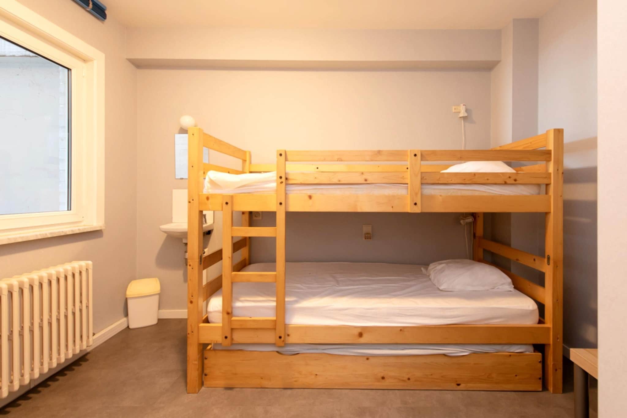 On the 6th floor: (open kitchen(hob(induction), electric kettle, toaster, coffee machine, combination microwave, dishwasher, fridge(+ freezer), Hand blender), Living/diningroom(TV(digital), dining table, seating area, DVD player), bedroom(double bed(twin duvet, 140 x 200 cm)), bedroom(double bed(twin duvet, 140 x 200 cm)), bedroom(single trundle bed(duvet, 90 x 200 cm), bunk bed(duvet, 90 x 200 cm)), bathroom(bathtub with shower, washbasin, washbasin, toilet), toilet(toilet))\n\nterrace, garden furniture, lift, Sea view