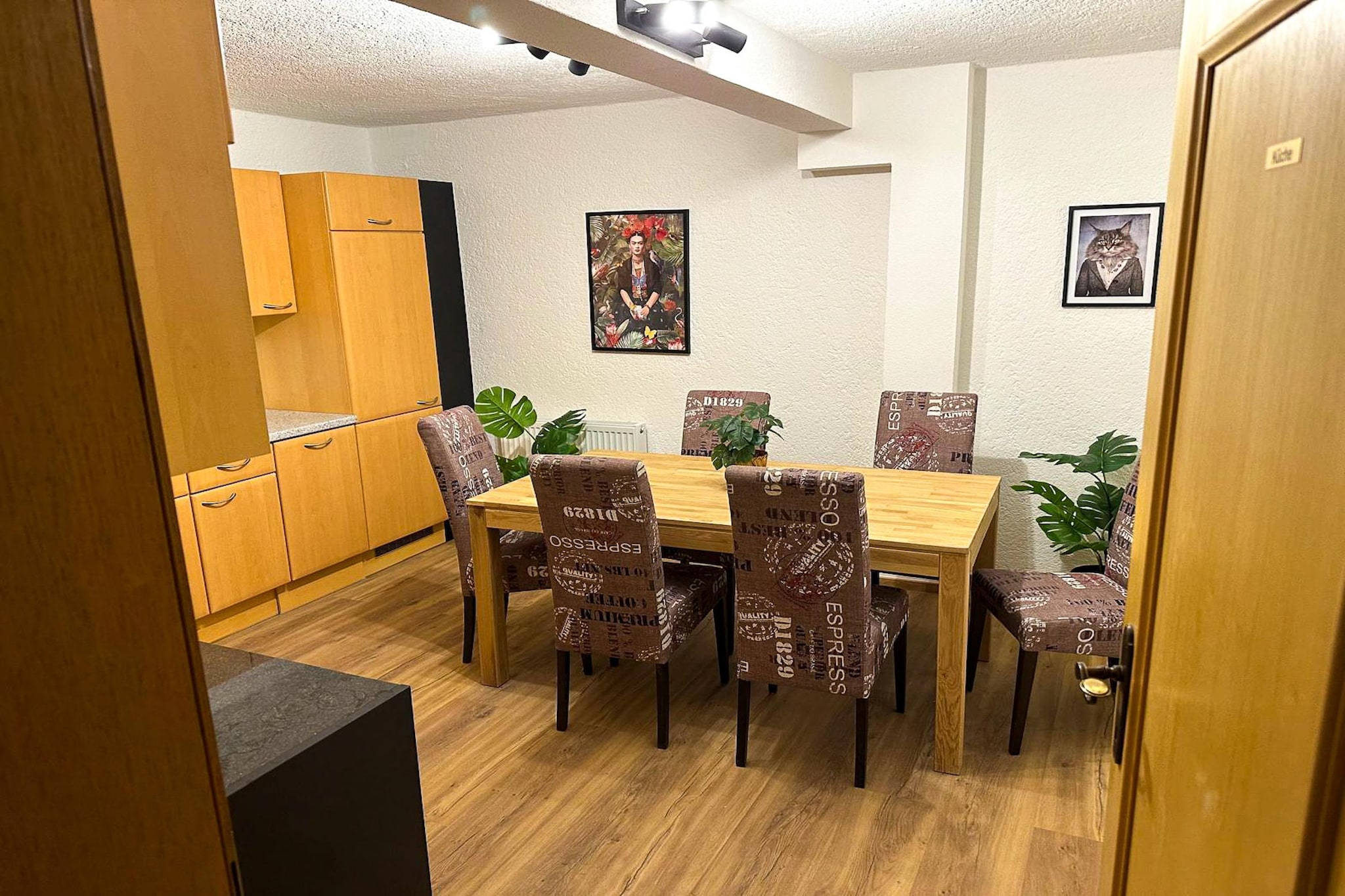 Attic: (open kitchen(electric kettle, coffee machine, fridge), Living/bed room(double fold-away bed, dining table, seating area), bathroom(shower, washbasin, toilet), balcony, air conditioning)\n\ntoilet, shared room, pantry(electric kettle, cooker, coffee machine, oven, microwave, dishwasher, fridge-freezer), bicycle storage, parking, Charging post for electric cars