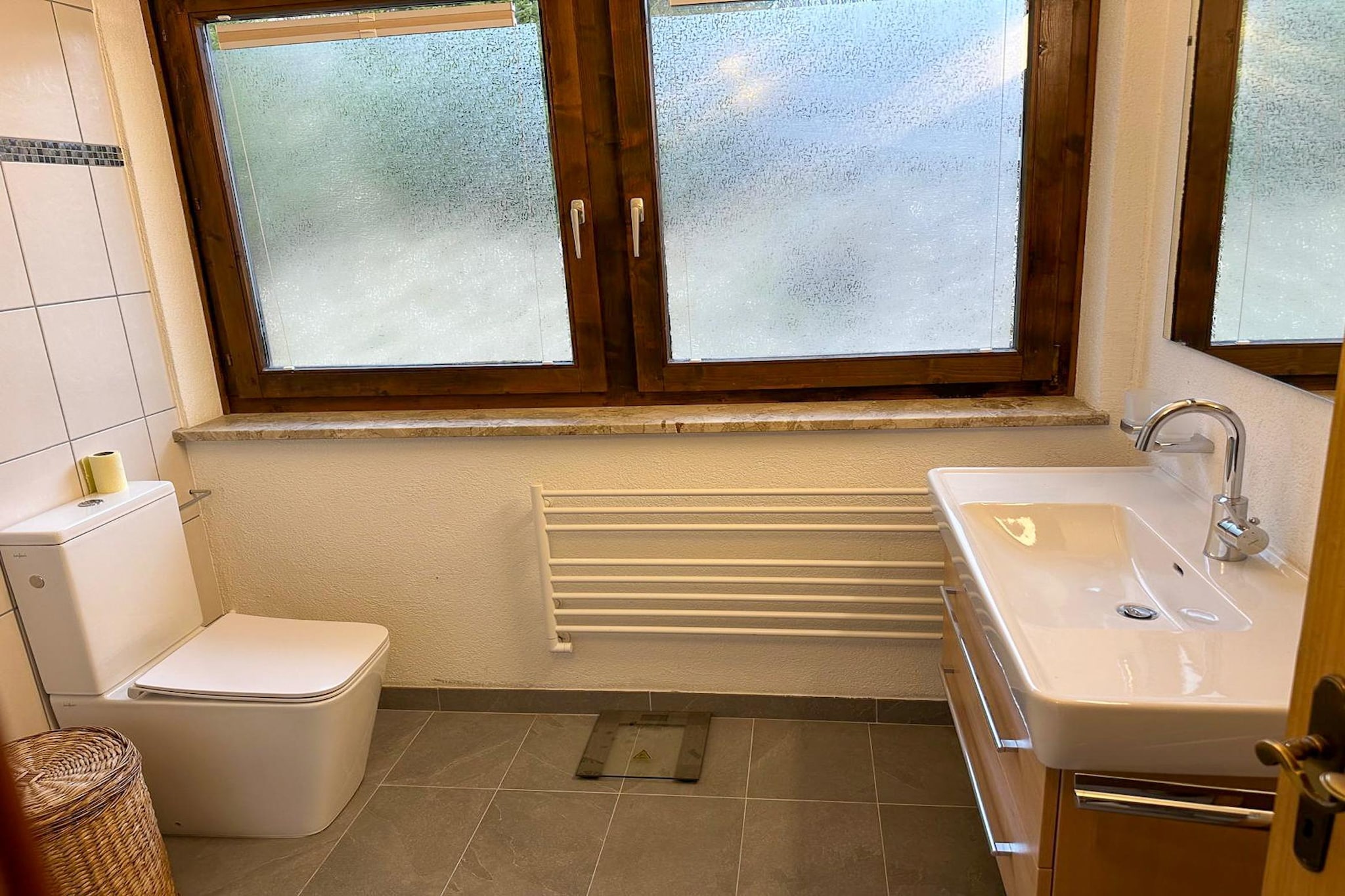 Attic: (open kitchen(electric kettle, coffee machine, fridge), Living/bed room(double fold-away bed, dining table, seating area), bathroom(shower, washbasin, toilet), balcony, air conditioning)\n\ntoilet, shared room, pantry(electric kettle, cooker, coffee machine, oven, microwave, dishwasher, fridge-freezer), bicycle storage, parking, Charging post for electric cars