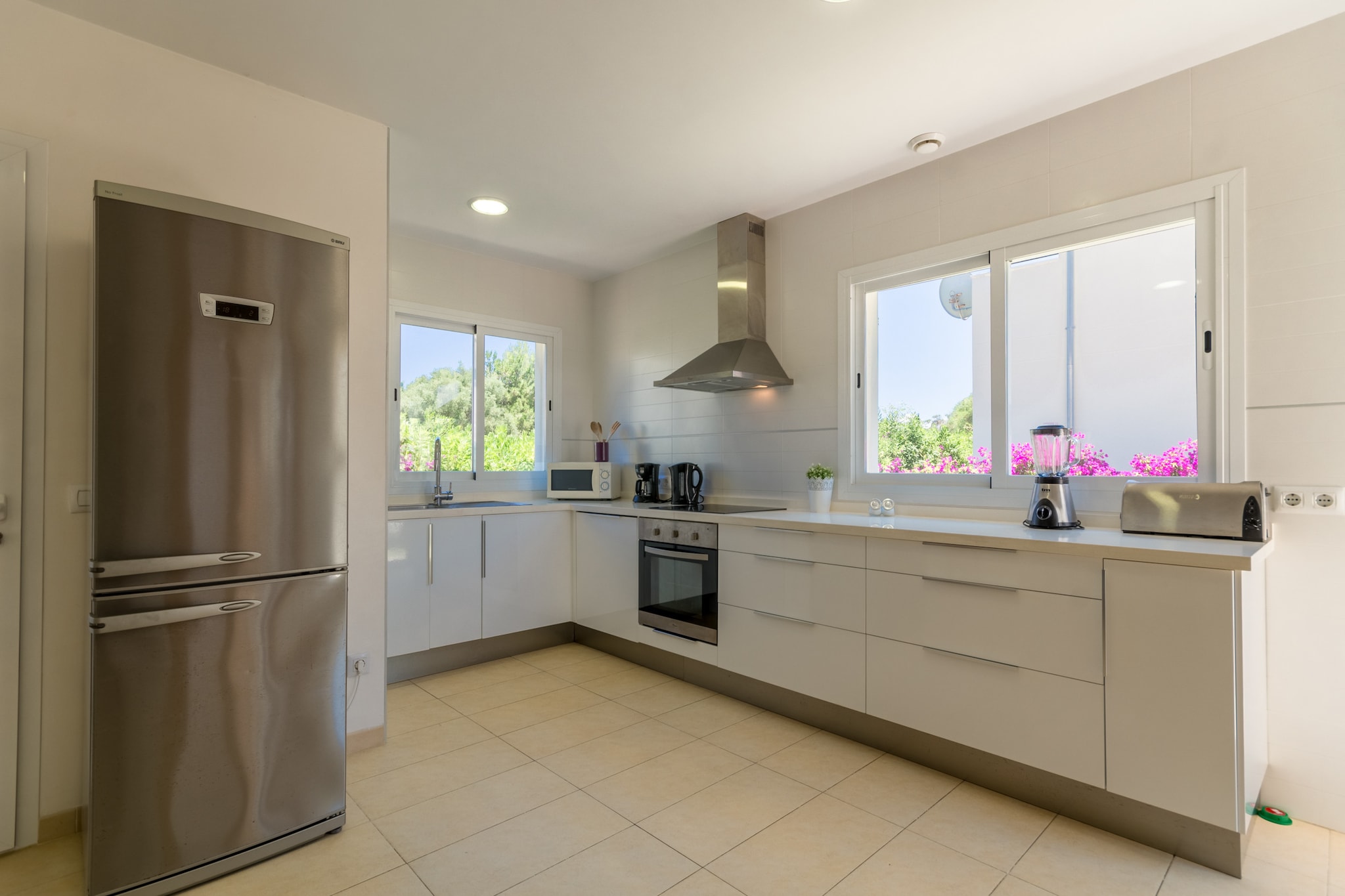 Ground floor: (Kitchen(electric kettle, toaster, coffee machine, oven, microwave, dishwasher, fridge-freezer, Juicer, electric hot plates, dishes and cutlery, Cooking basics), Living/diningroom(TV(satellite), dining table, seating area, DVD player), bedroom(double bed), bathroom(bath tub), Internet access)\n\nOn the 1st floor: (bedroom(single bed, single bed, TV), bedroom(single bed, single bed), bedroom(double bed, TV), bathroom(shower), bathroom(shower))\n\nGarden Furniture , solarium, washing machine, balcony, heating(central), air conditioning, terrace, garden, sun loungers, BBQ, parking, swimming pool(private), iron